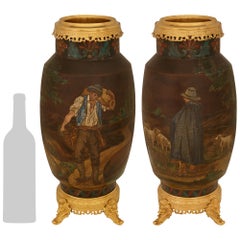 pair of Continental 19th century Terra Cotta and Ormolu urns
