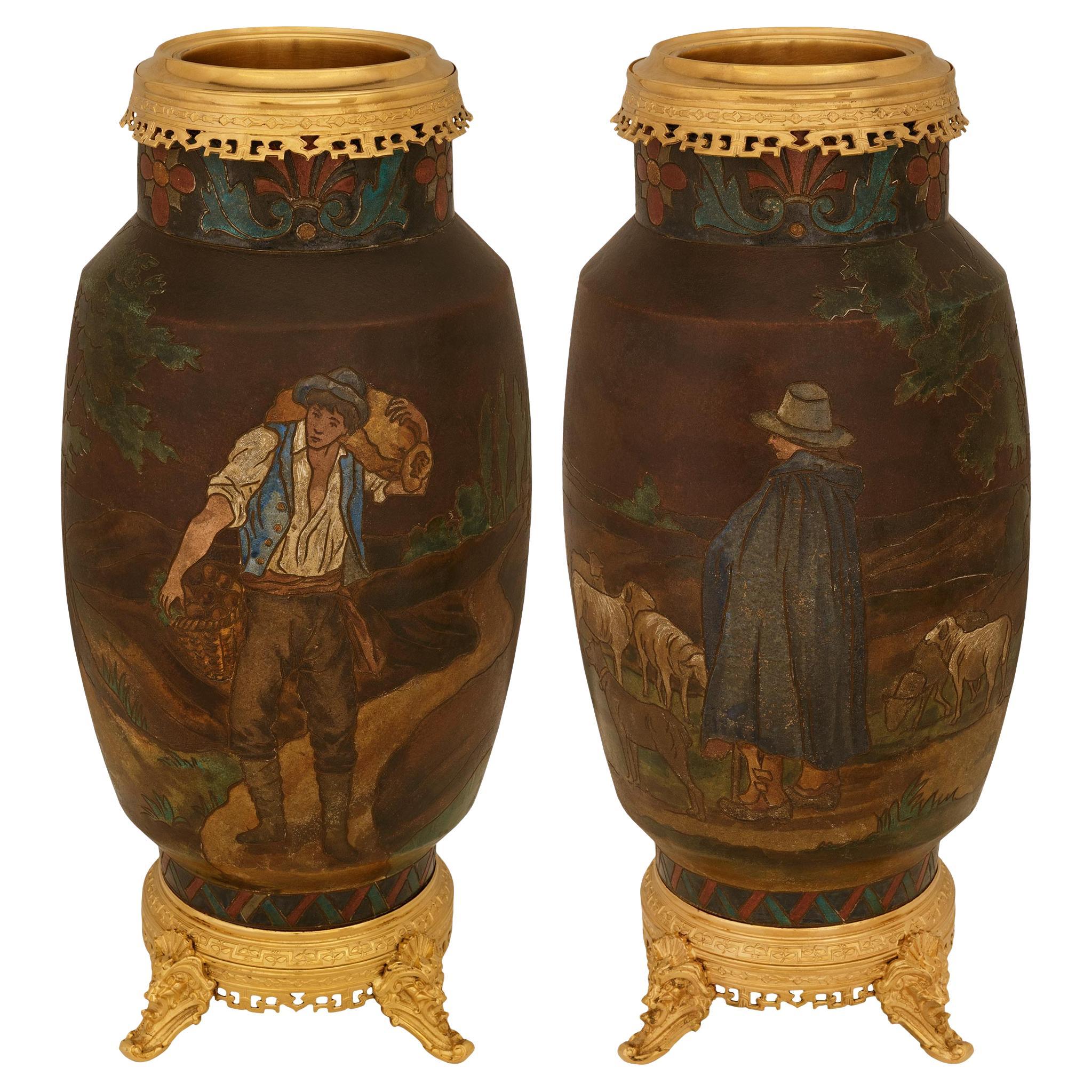 pair of Continental 19th century Terra Cotta and Ormolu urns