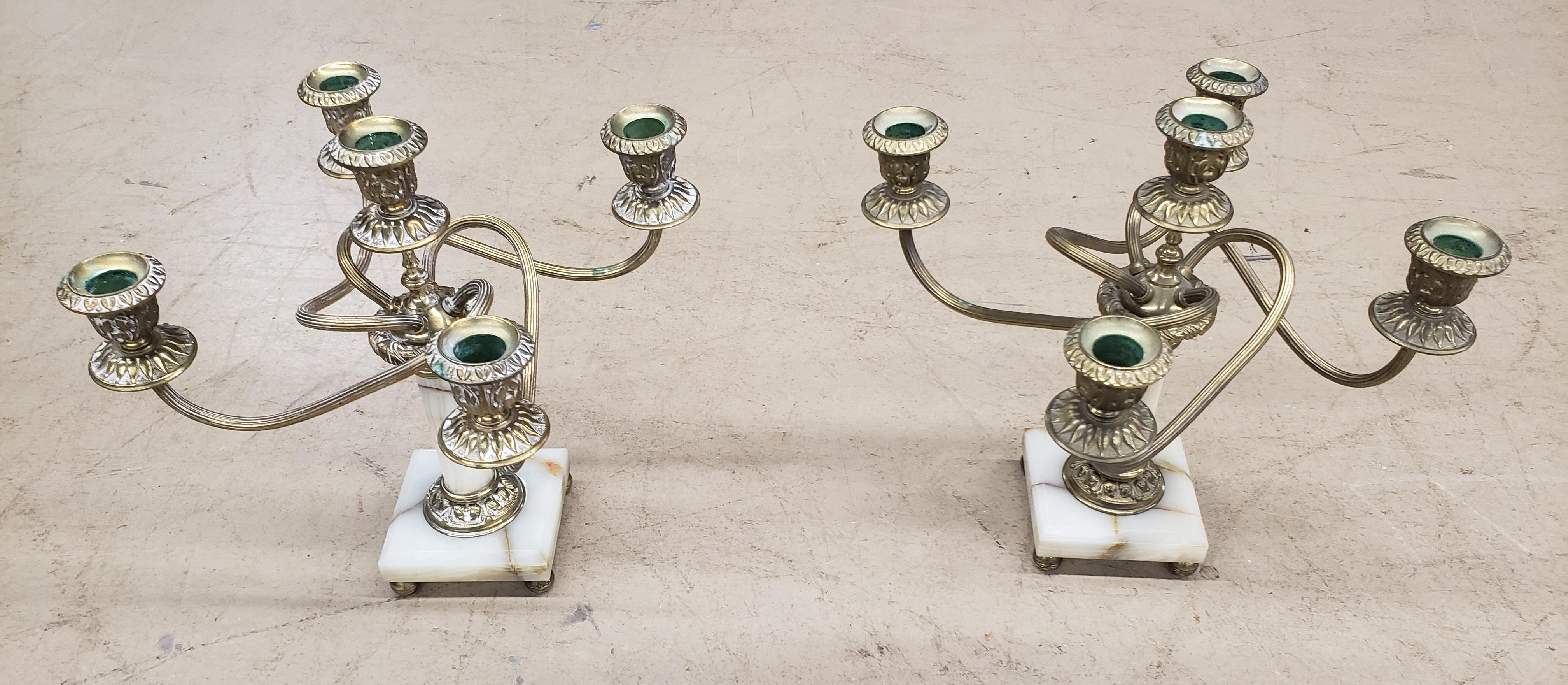 A unique pair of Italian patinated brass and onyx candleholders in
Good vintage condition.Measure 11