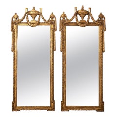 Pair of Continental Gilded Roman Swag and Urn Motif Mirrors