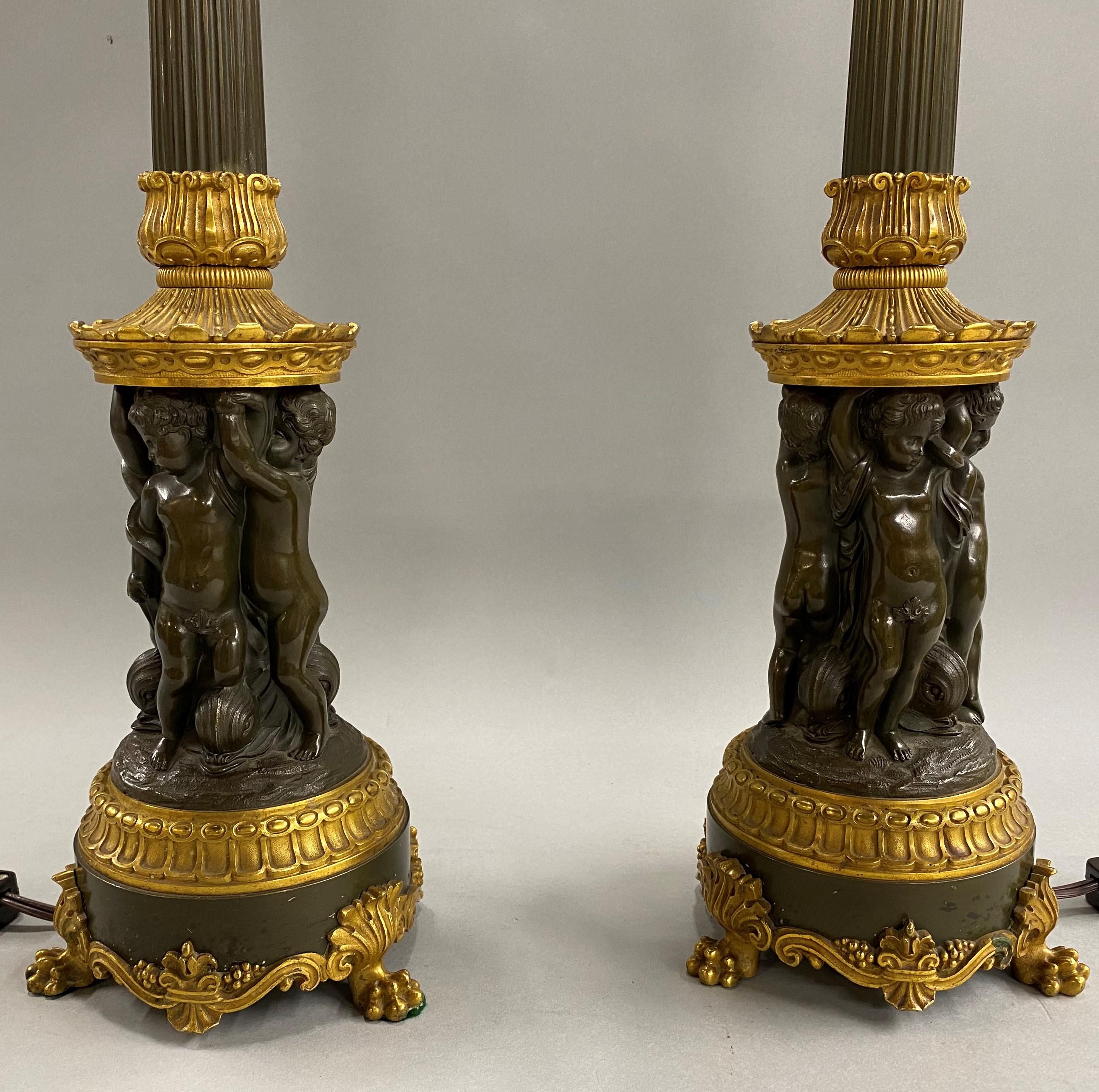 20th Century Pair of Continental Gilt and Bronze Five-Light Candelabra Lamps with Putti
