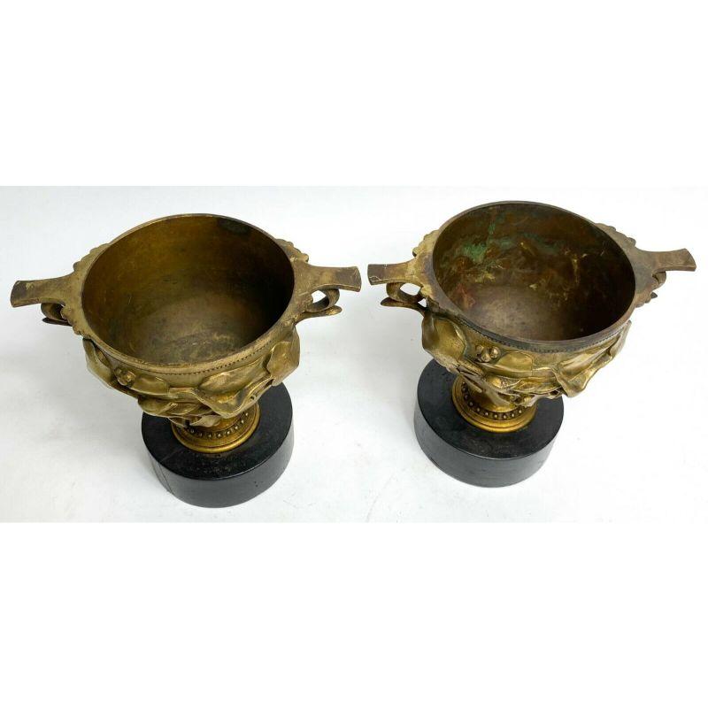 Pair of Continental gilt bronze twin handled cups boscoreale, circa 1900

These cups are modeled after the Boscoreale cups found in the Pompeii excavation. Each cup is mounted to a round wooden base. 

Additional information:
Type: