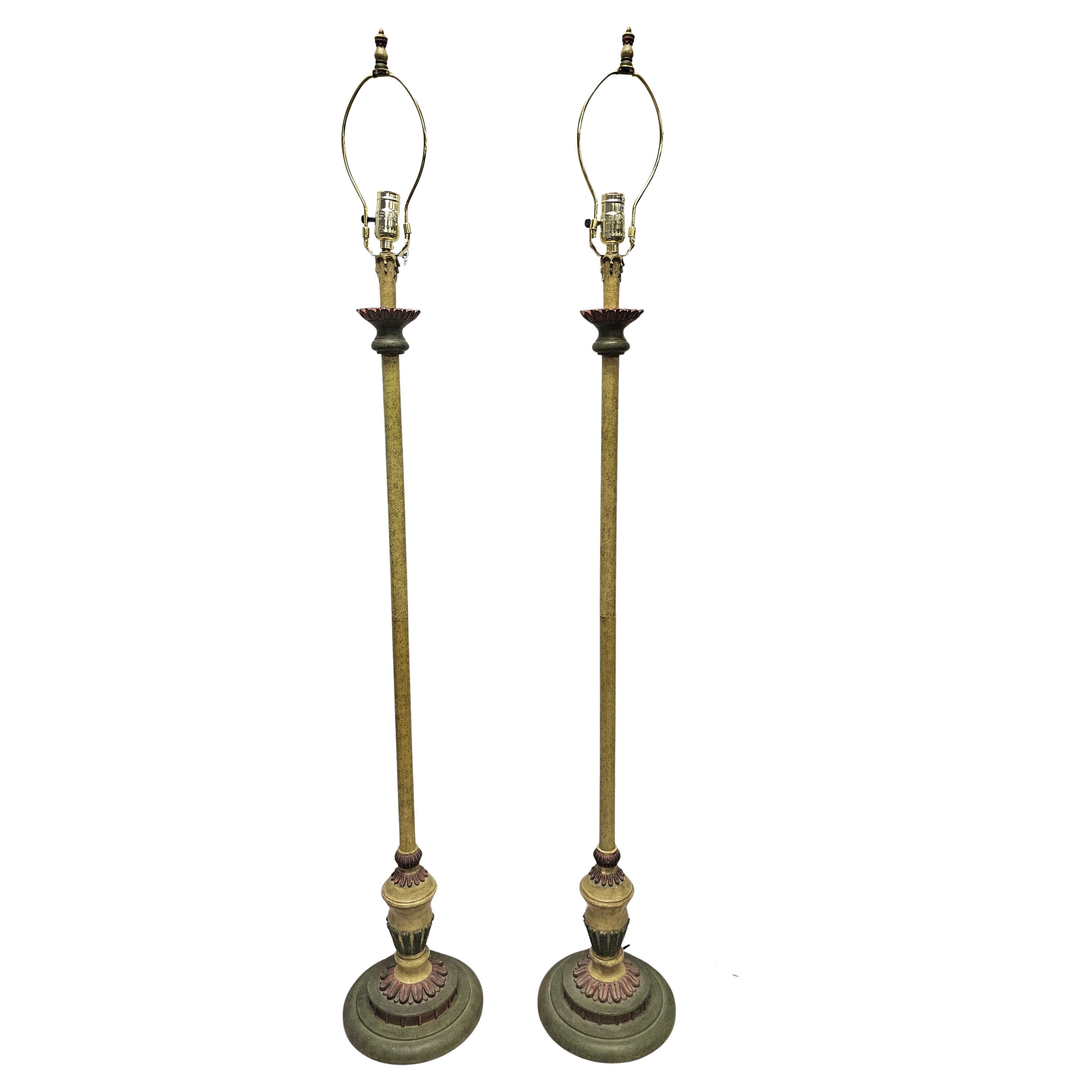 A Pair of Continental Green and Parcel Gilt Decorated Floor Lamps
Measures 9