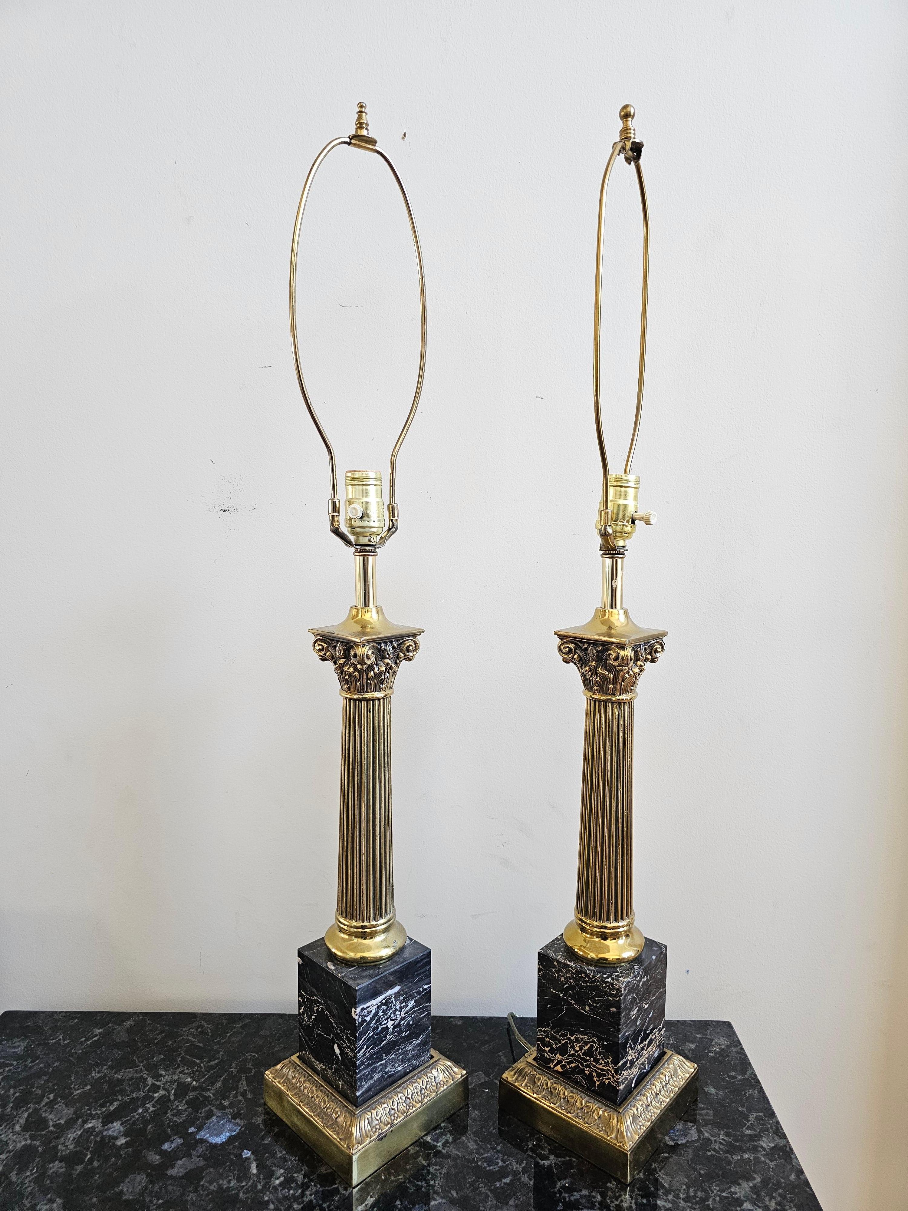 A magnificent Pair Of Continental Marble And Brass Columnar Form Table Lamps. Measures 5.5