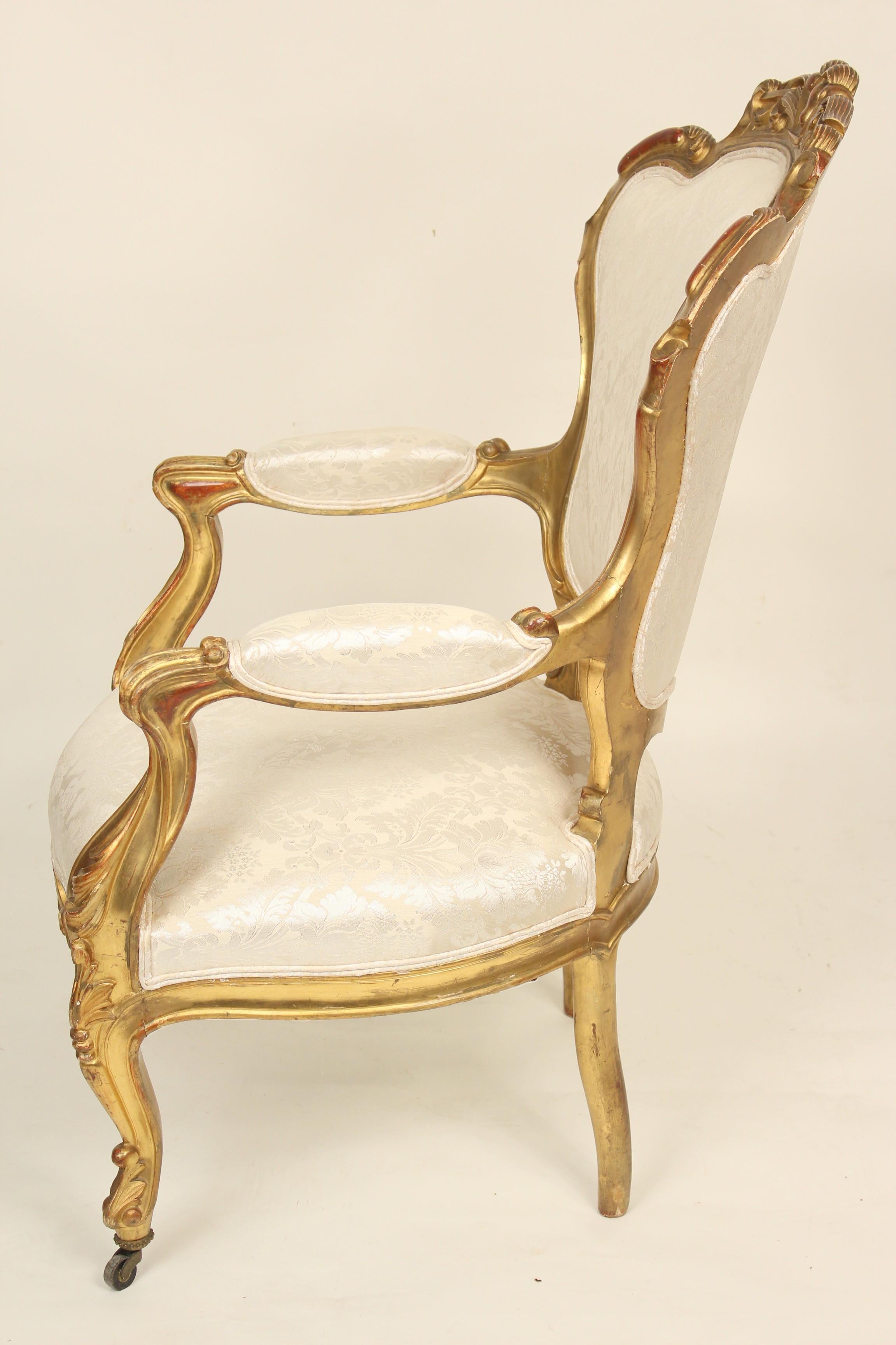 19th Century Pair of continental Napoleon III gilt wood armchairs