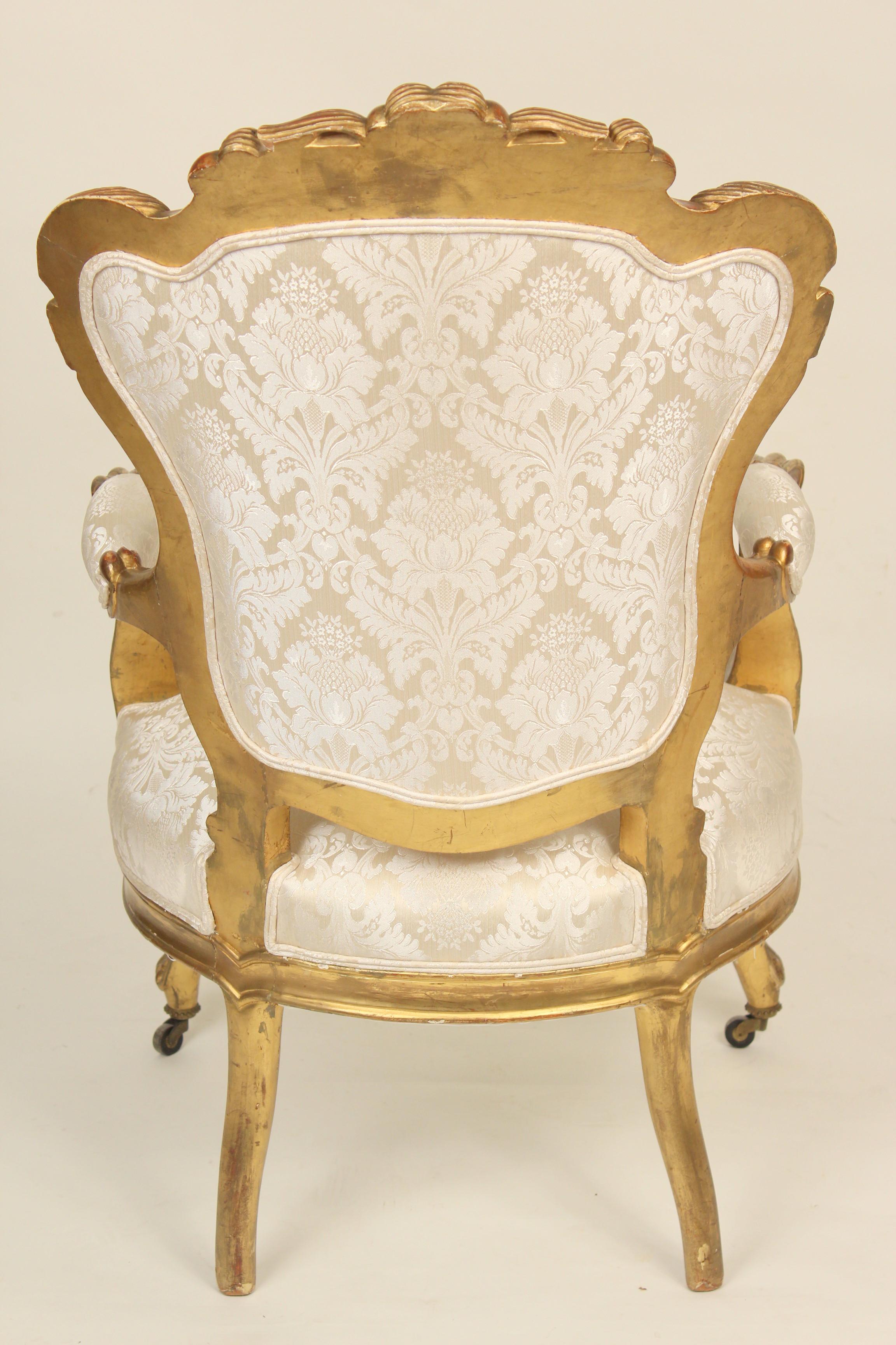 Paint Pair of continental Napoleon III gilt wood armchairs