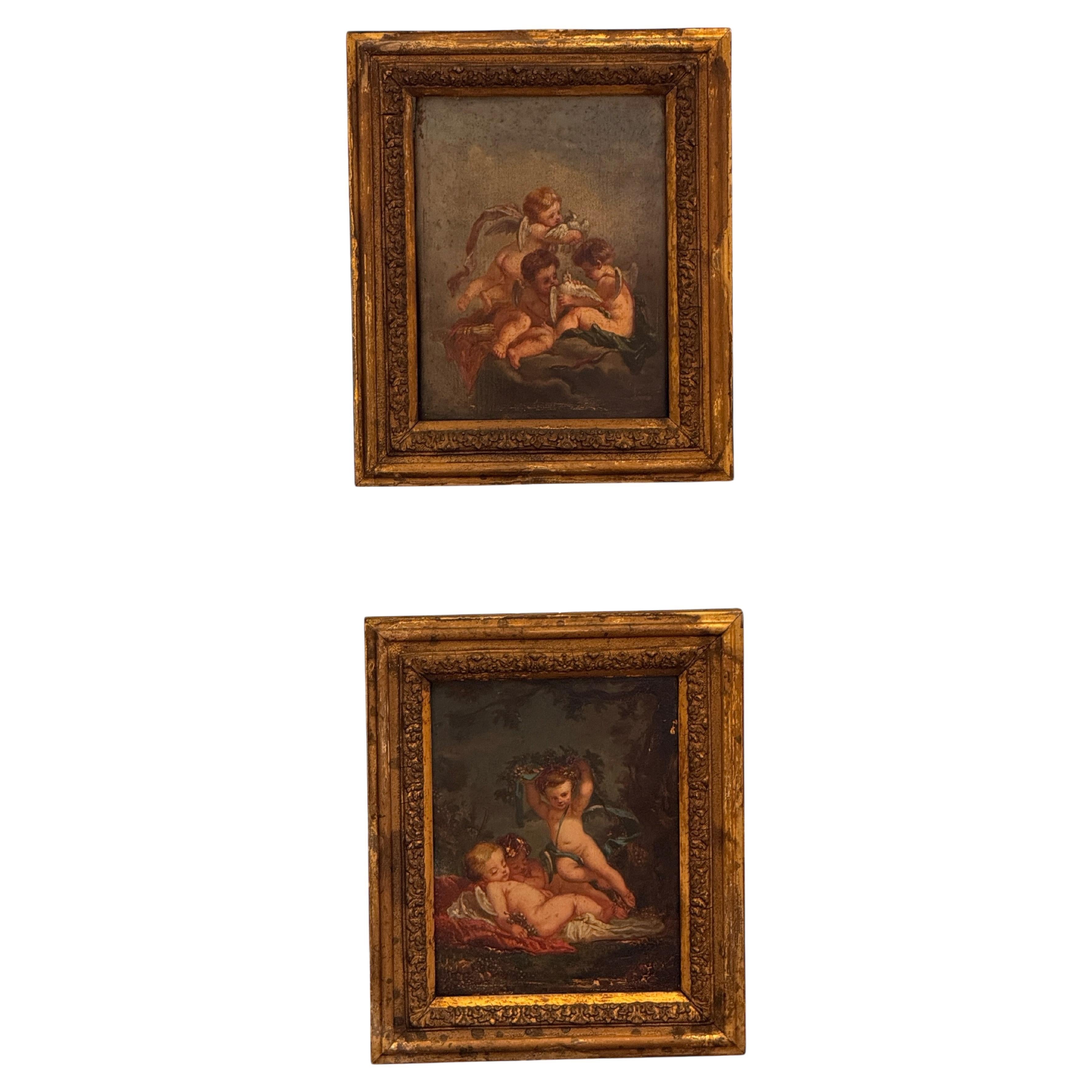 Paire de peintures continentales représentant des figures chérubines