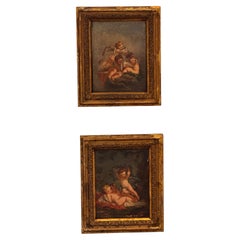 Paire de peintures continentales représentant des figures chérubines