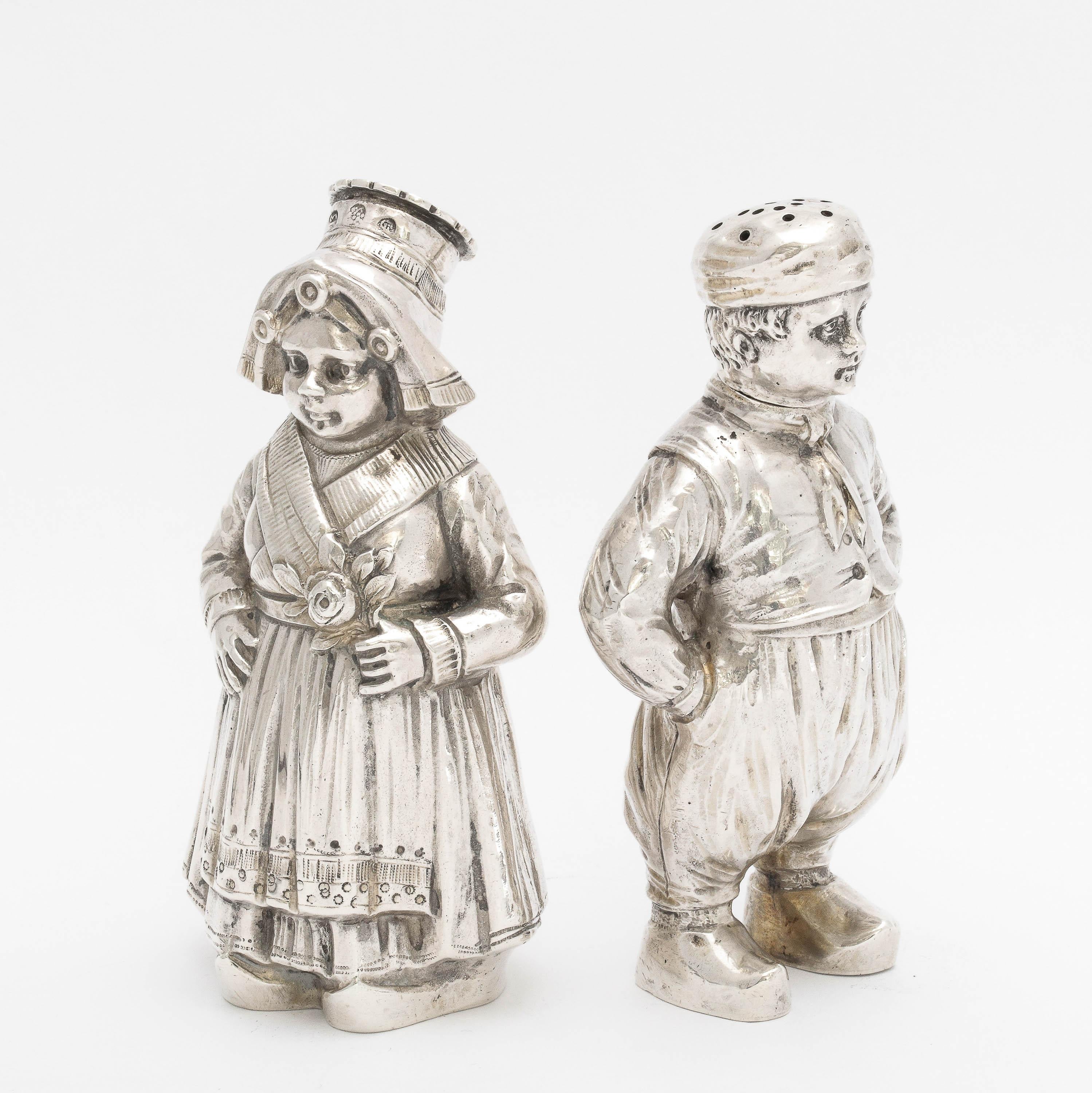 Early 20th Century Pair of Continental Silver '.835' Dutch Boy and Girl Salt and Pepper Shakers