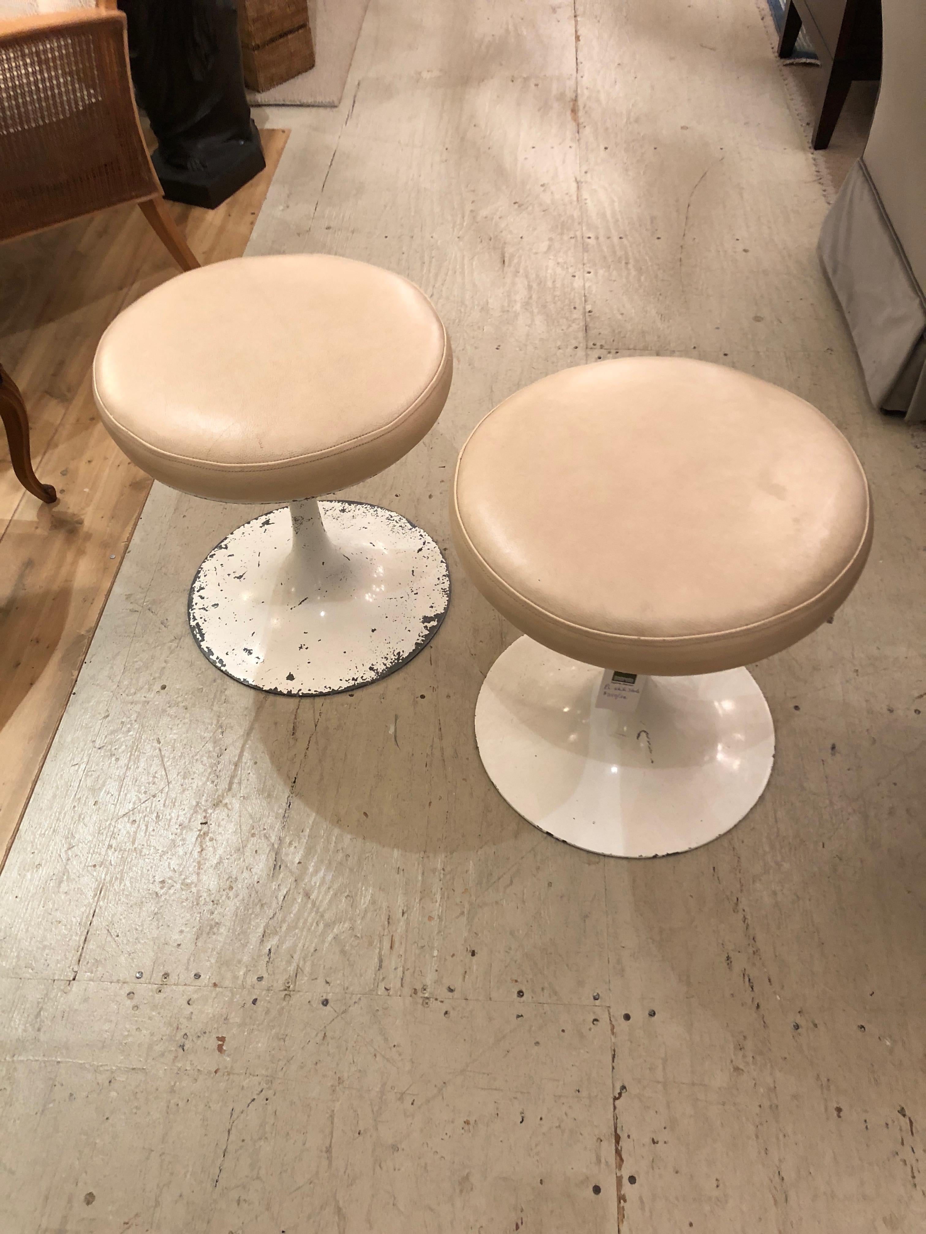 Funky Mid-Century Modern beige leather topped stools, great stylish extra seating, having cool tulip style white painted metal bases.