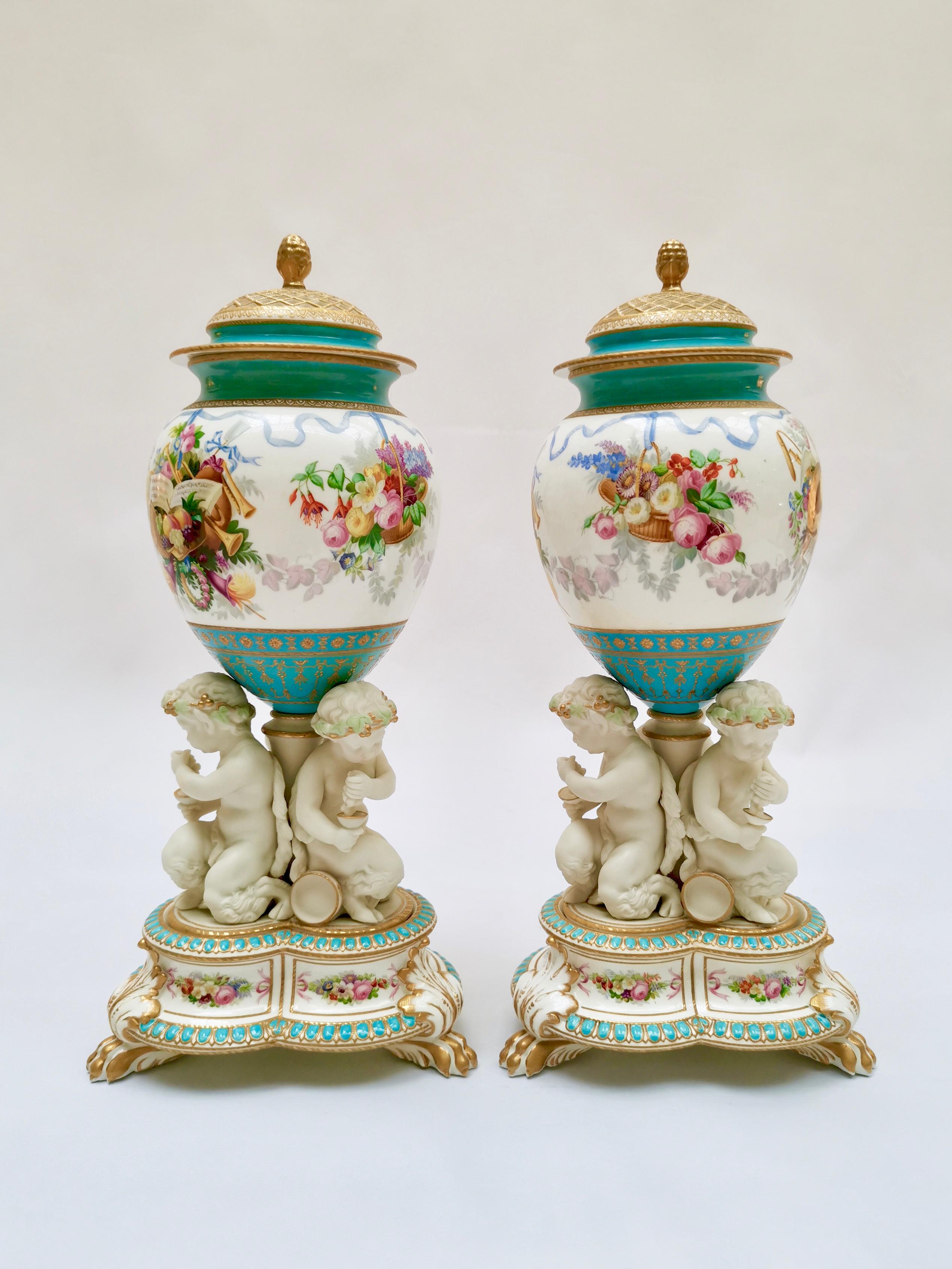 This is a stunning pair of two lidded potpourri vases made by Copeland in 1891. Potpourri vases were used in the 19th century to fill with scented materials to freshen up the air inside the home. These vases have outstanding bases with parian putti
