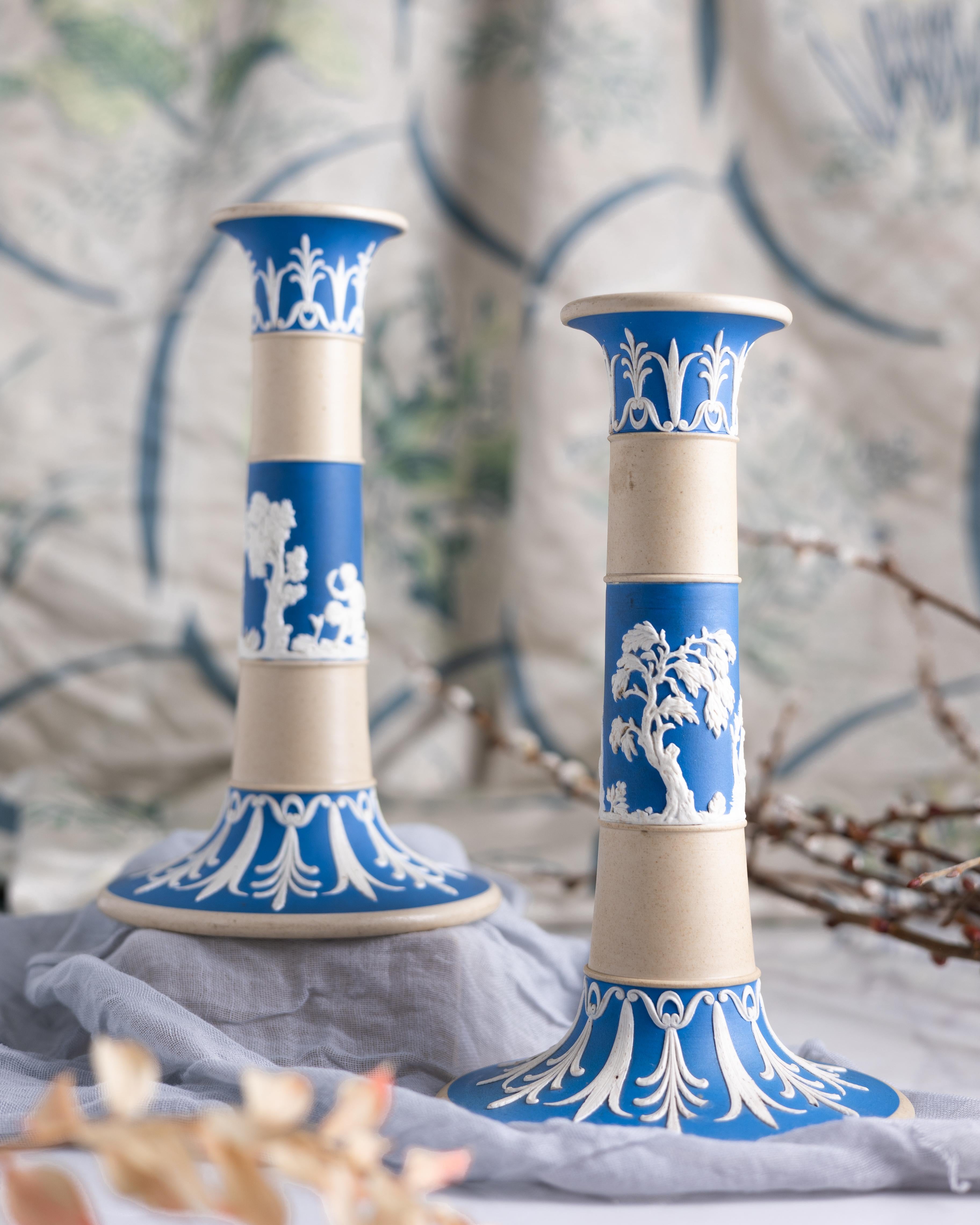 A pair of neoclassical style tricolor jasperware candlesticks, made by Copeland circa 1850.

Developed by Wedgwood in the 1770s, jasperware became so popular that other potteries began making their own versions. The Neoclassical imagery on bright