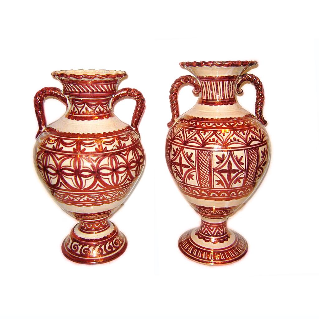 A pair of circa 1920's Italian copper-glazed porcelain vases with twisted handles.

Measurements:
Height: 19.5