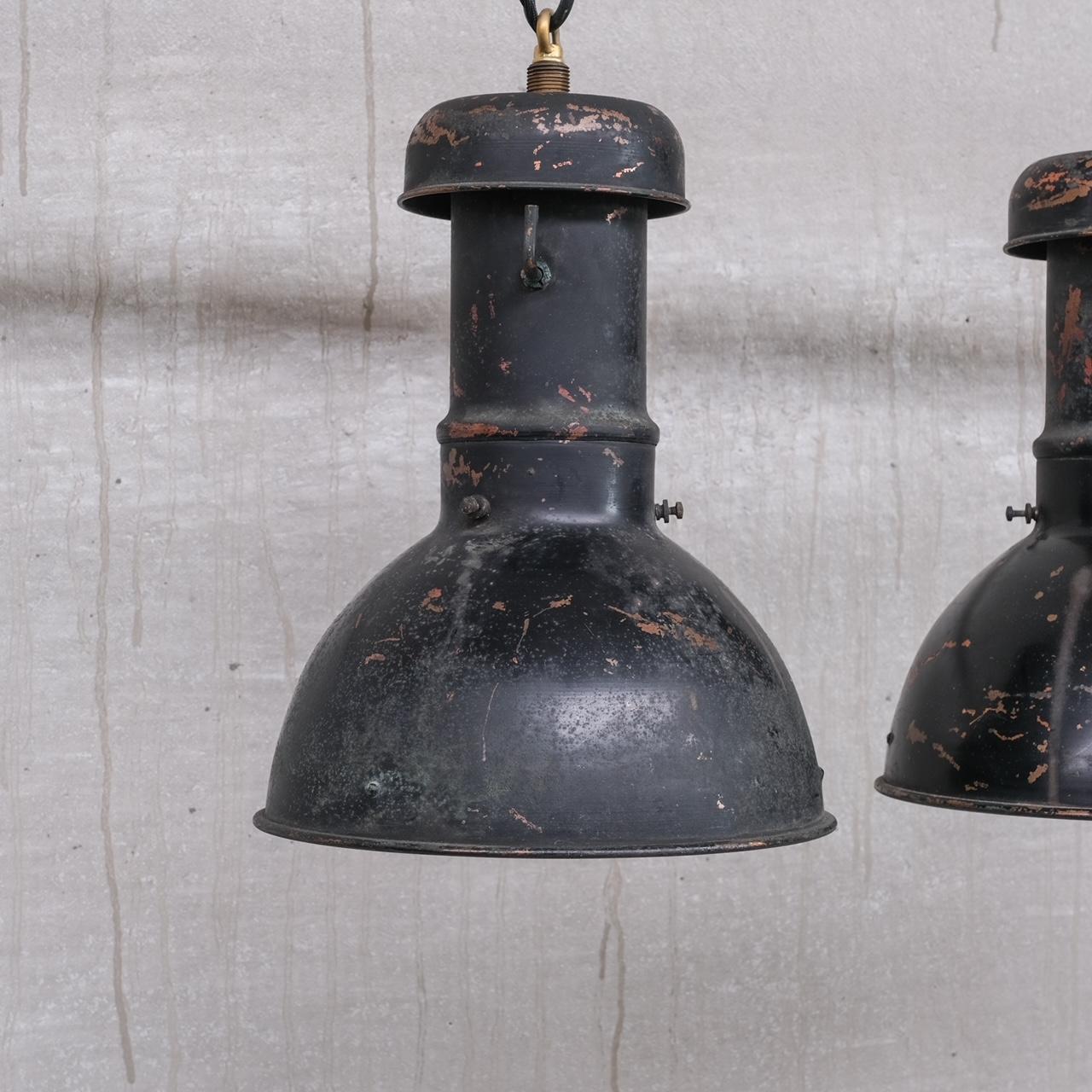A pair of copper pendant lights.

Mercury glass mirrored internal shades.

France, circa 1920s.

Price is for the pair.

Re-wired and PAT tested.

Good condition, some scuffs and wear commensurate with age. They could be sprayed again on