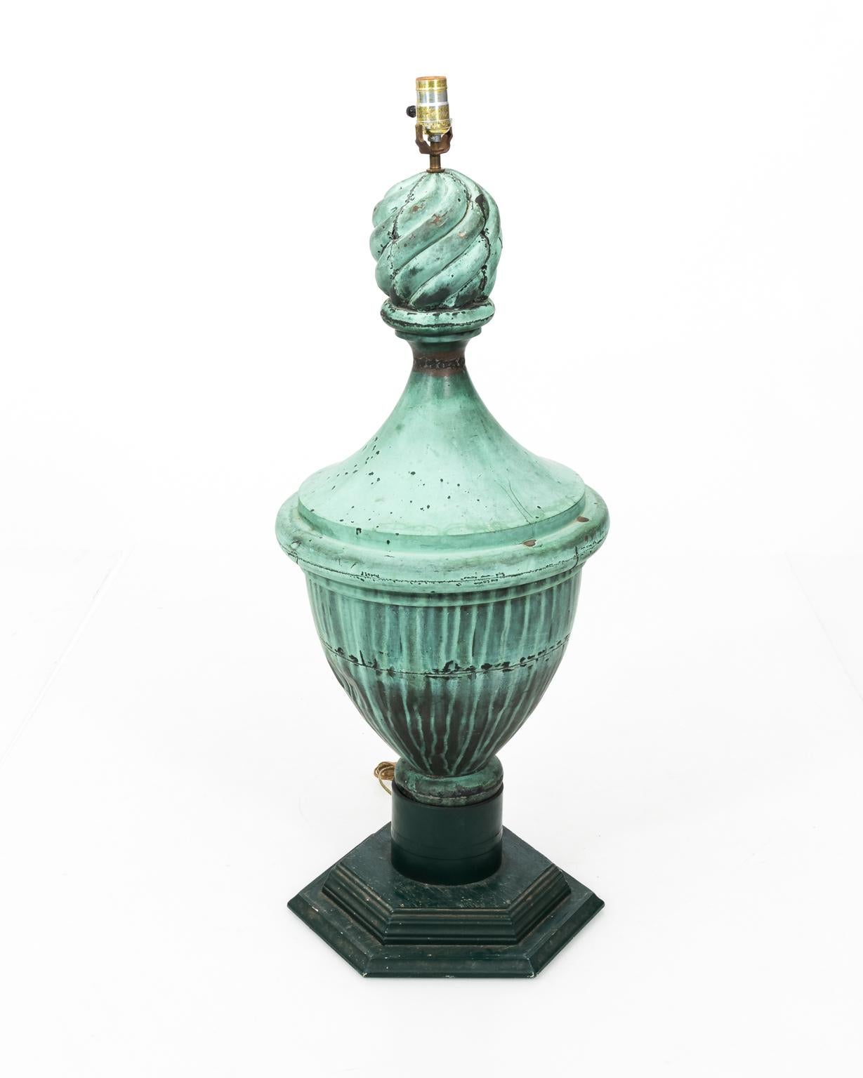 Pair of copper neoclassical style urn finials mounted as lamps with a verdigris finish on wooden bases, circa 1890. Shades not included. Please note that these lamps have wear with age including indents on the body.