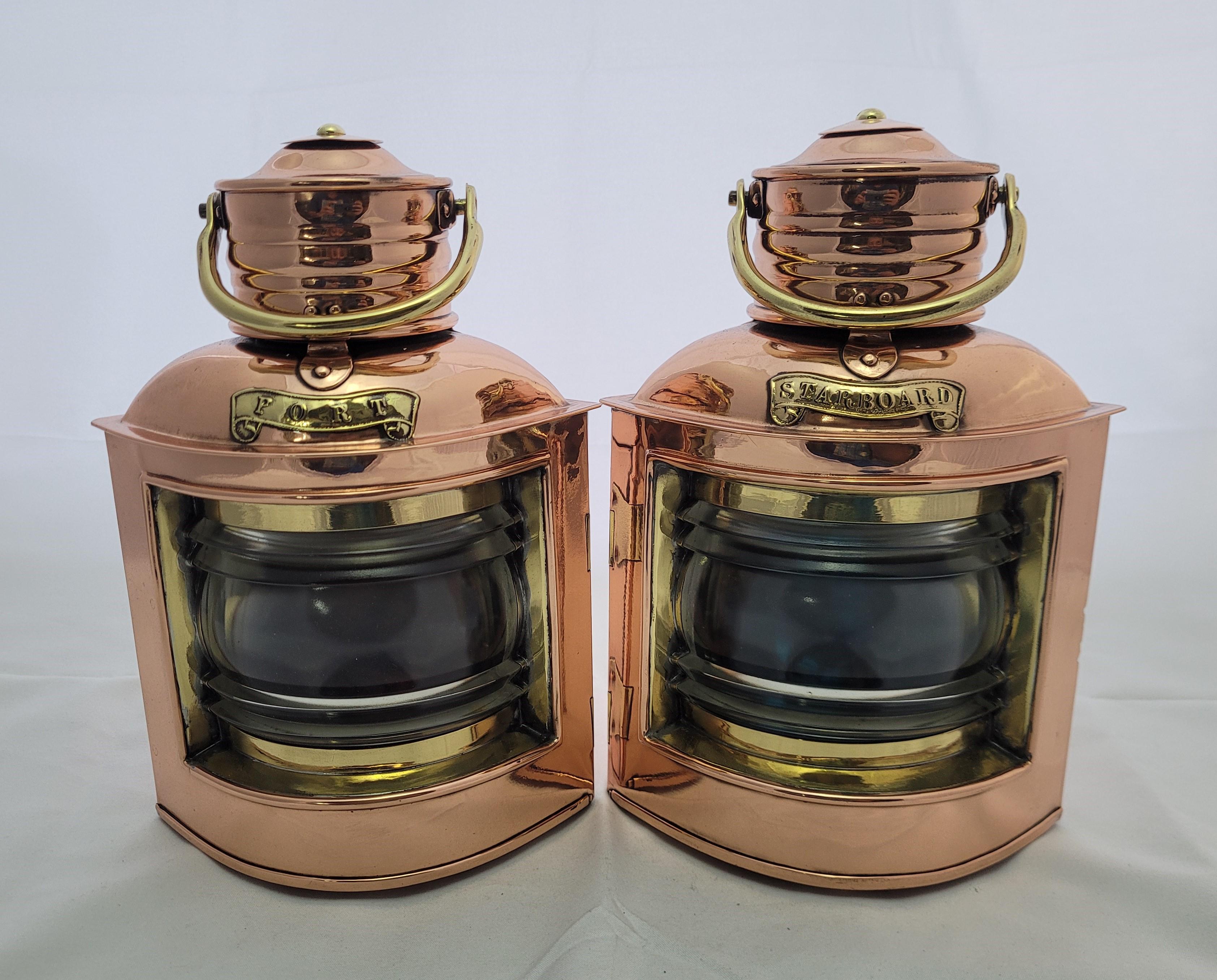 Copper and brass port and starboard boat lanterns. English made. Copper cases with brass trim including lens bezels, handles, port and starboard badges, brackets, hinges, door latch, etc.. Clear Fresnel glass lenses with red and blue filters. Choice