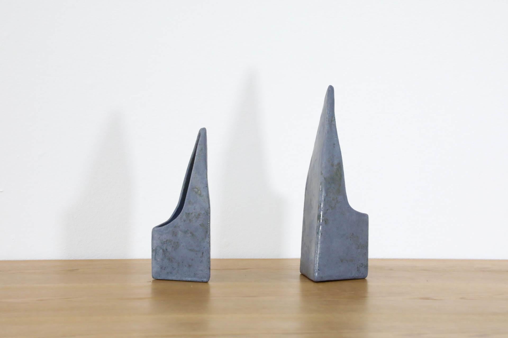 Set of two lavendar-gray ceramic abstract table vases by Dutch ceramic company, Cor Unum. The ceramics studio Cor Unum, founded in 1953, manufactures ceramics designed by prominent (international) designers, architects, artists, and other creatives.