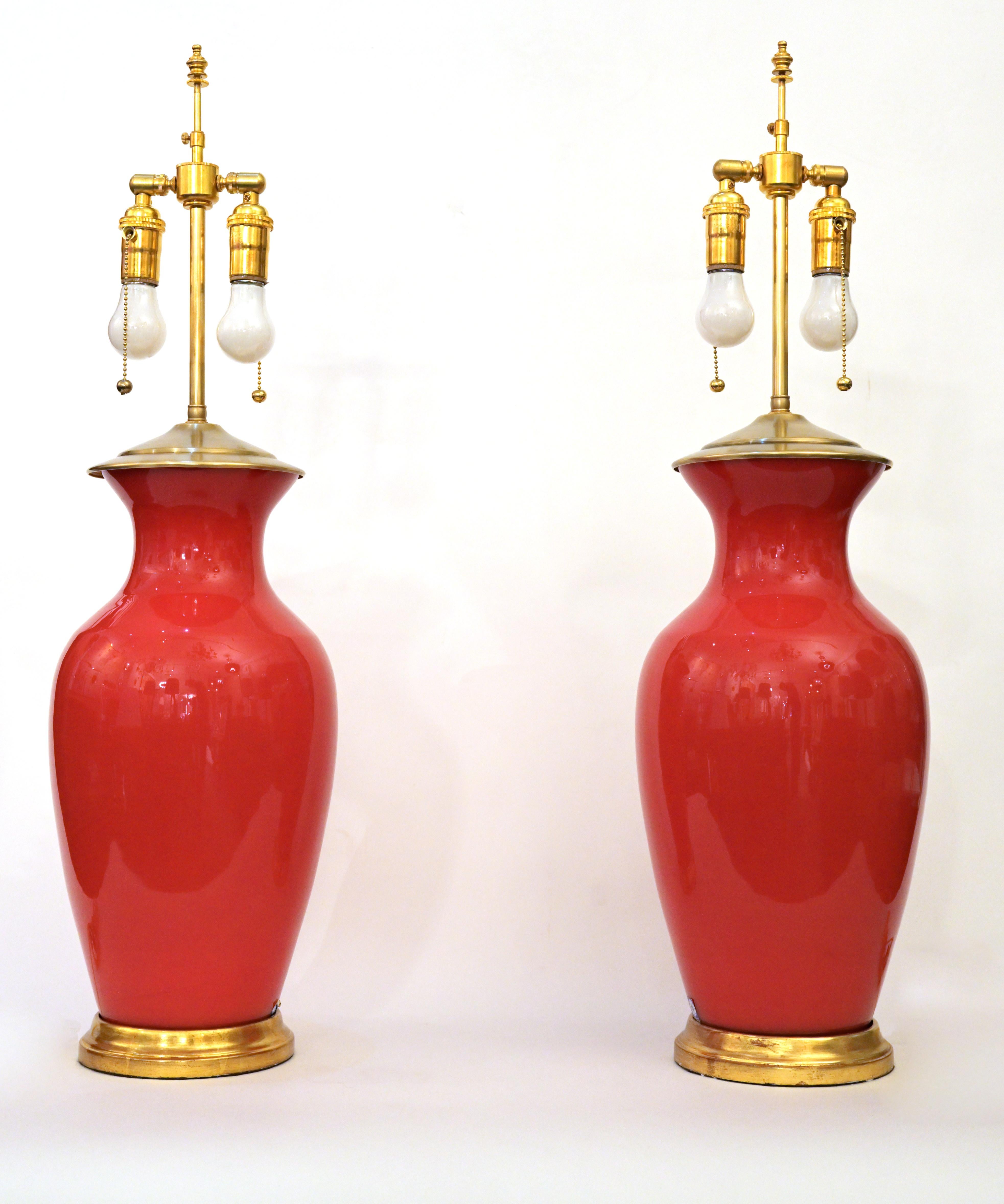 A pair of table lamps made from vintage Murano Glass Lamps having gilt wood bases and brass finials with adjustable double cluster, each sockets with 60 watts maximum. Shades are not included.

Center Diameter: 8