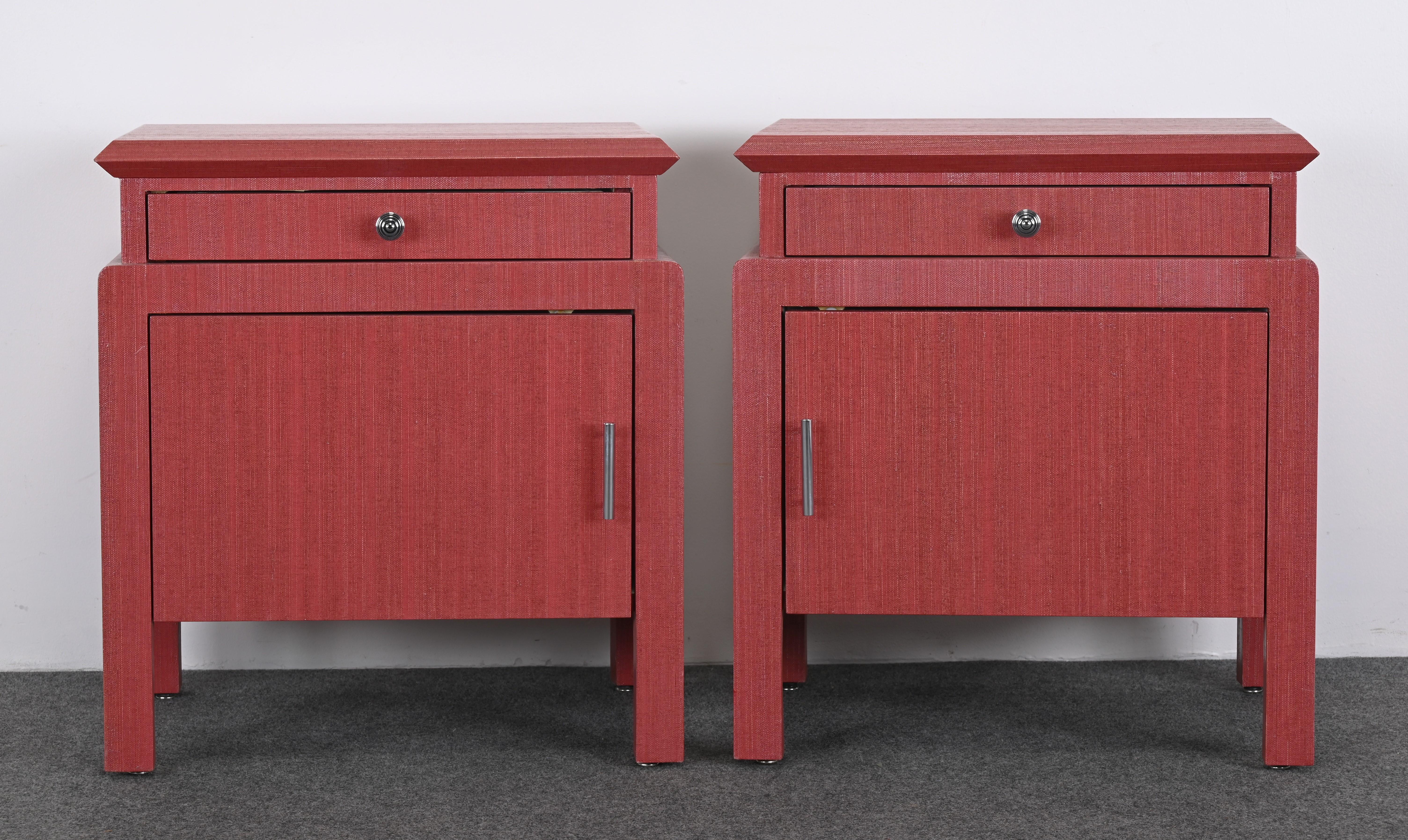 A lovely pair of linen-wrapped coral-tone bedside tables or nightstands attributed to Harrison Van Horn. These bedside tables have a great size and scale and would look great in any bedroom. The end tables have interesting chrome handles that can be