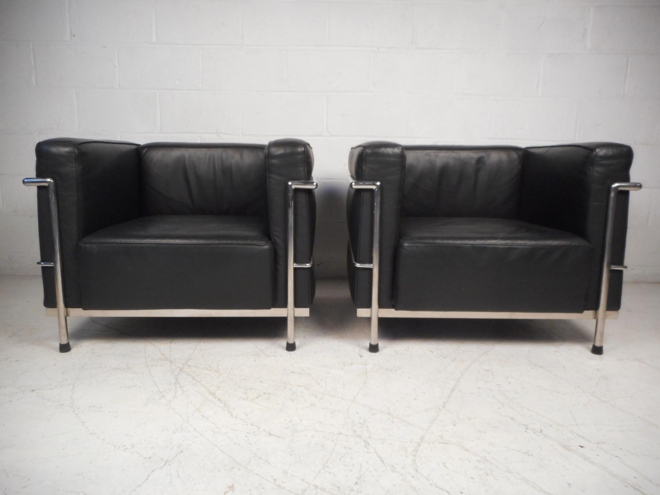 Pair of Corbusier lounge chairs. Spacious seating with comfortable cushions together with an iconic midcentury design. Sure to make an impression in any modern interior. Please confirm item location with dealer (NJ or NY).