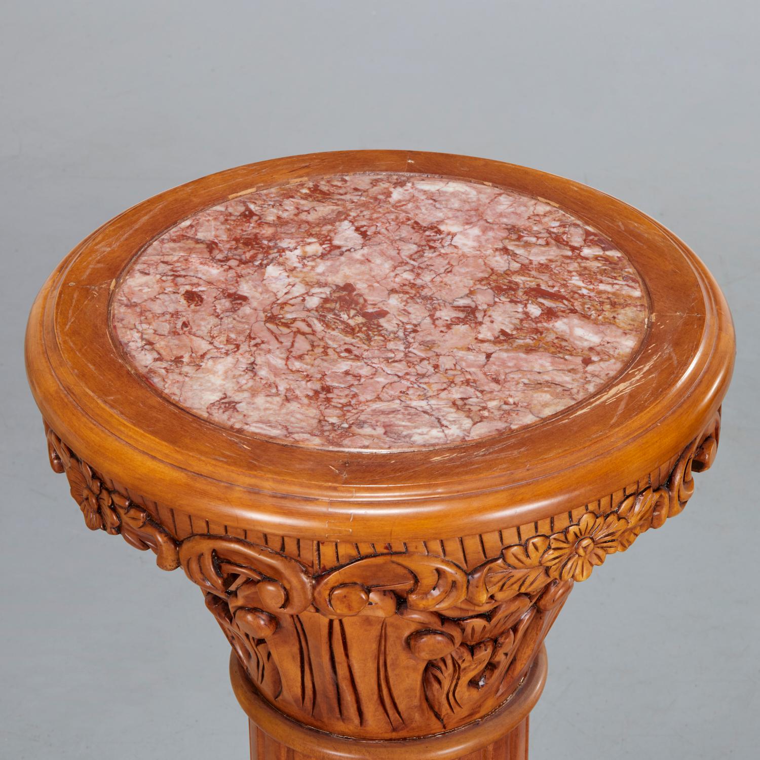 A pair of 20th c., side tables/stands, the round top with inset rouge breche marble, above a foliate carved capital on a fluted column. These tables/stands are richly carved and are quite decorative. Given their height and width they are very