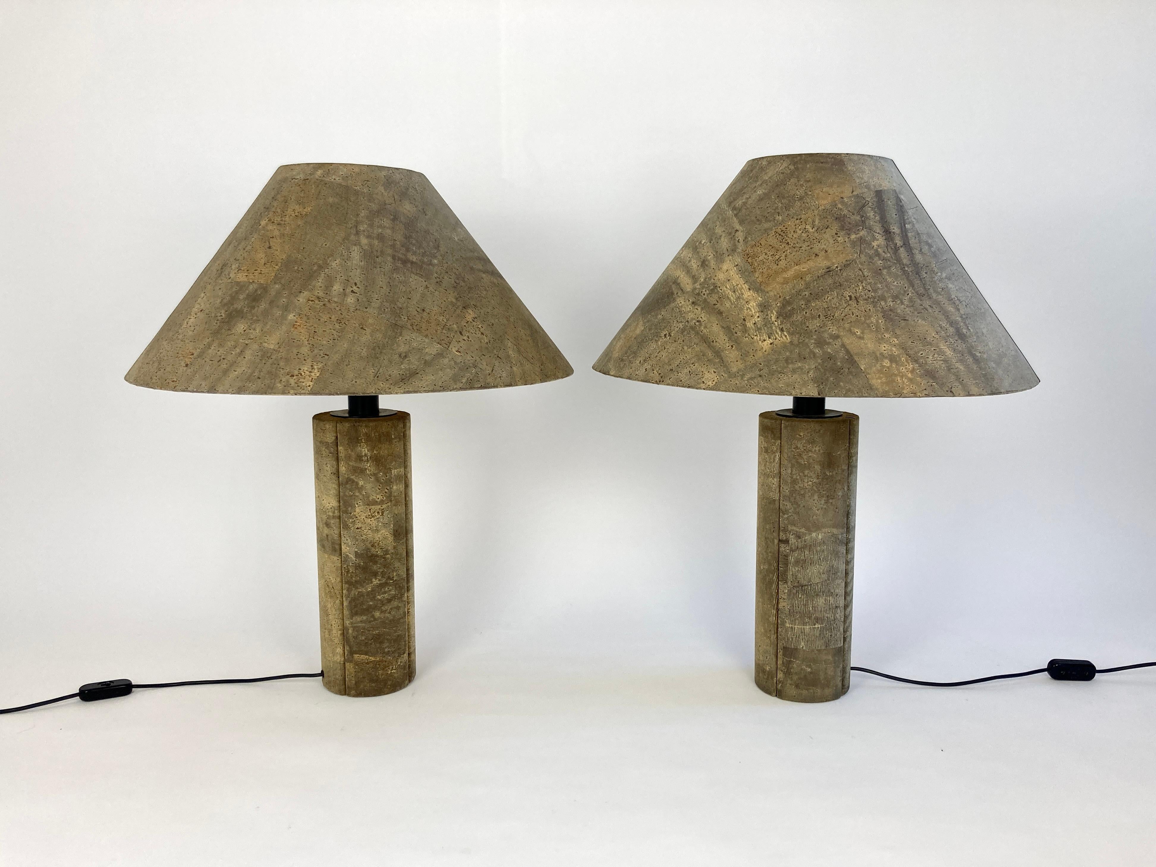 Pair of huge iconic cork table lamps designed by Wilhelm Zanoth and Ingo Maurer in 1974. 

Cylindrical base and and conical shade covered in thin slices of cork veneer giving a wonderful natural minimalist look.

The lamp's sheer size make it