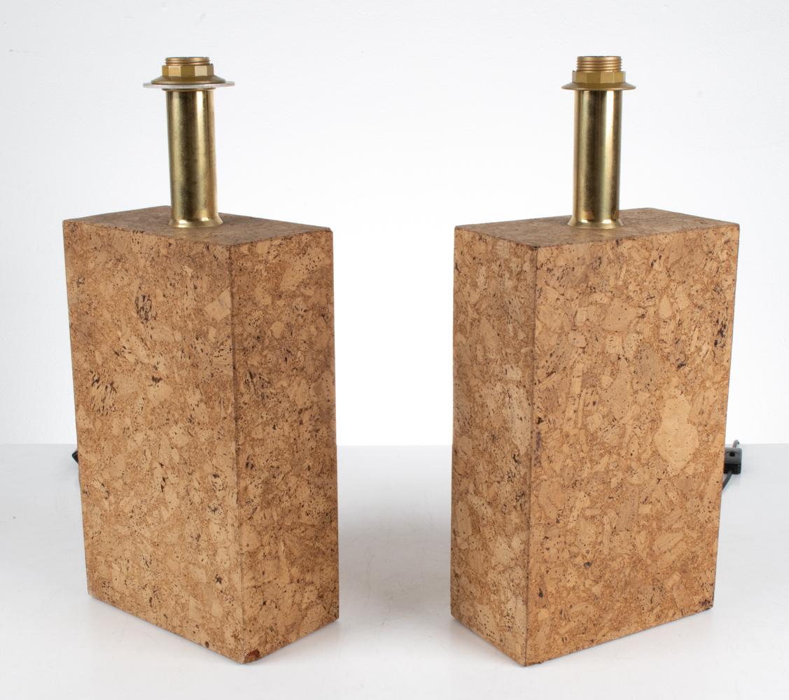 Discover a captivating fusion of creativity and craftsmanship with this remarkable pair of cork table lamps, produced by the Swiss manufacturer Temde Leuchten in the style of the iconic Ingo Maurer. Embrace the essence of artistic illumination as