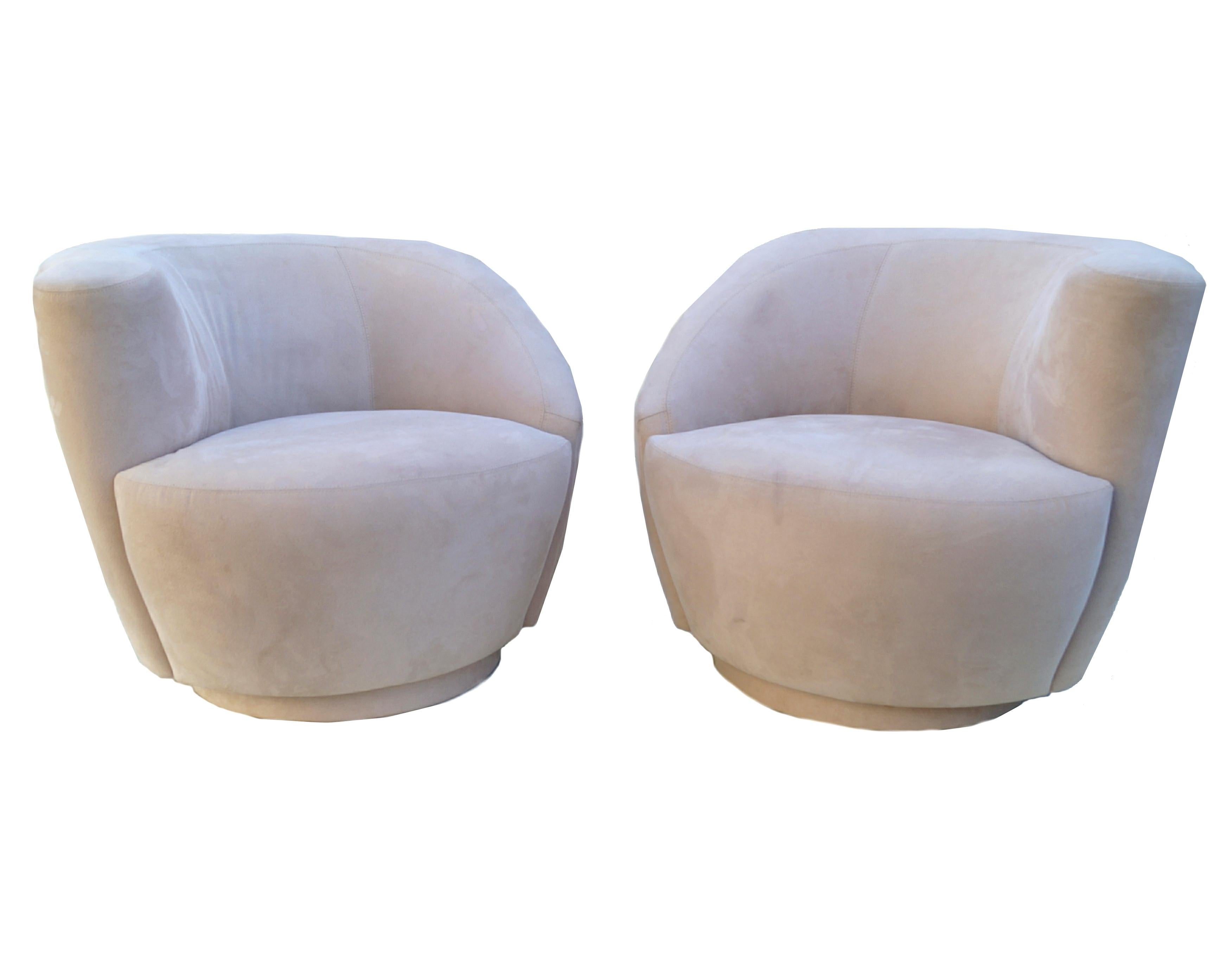 Pair of corkscrew swivel lounge chairs armchairs.