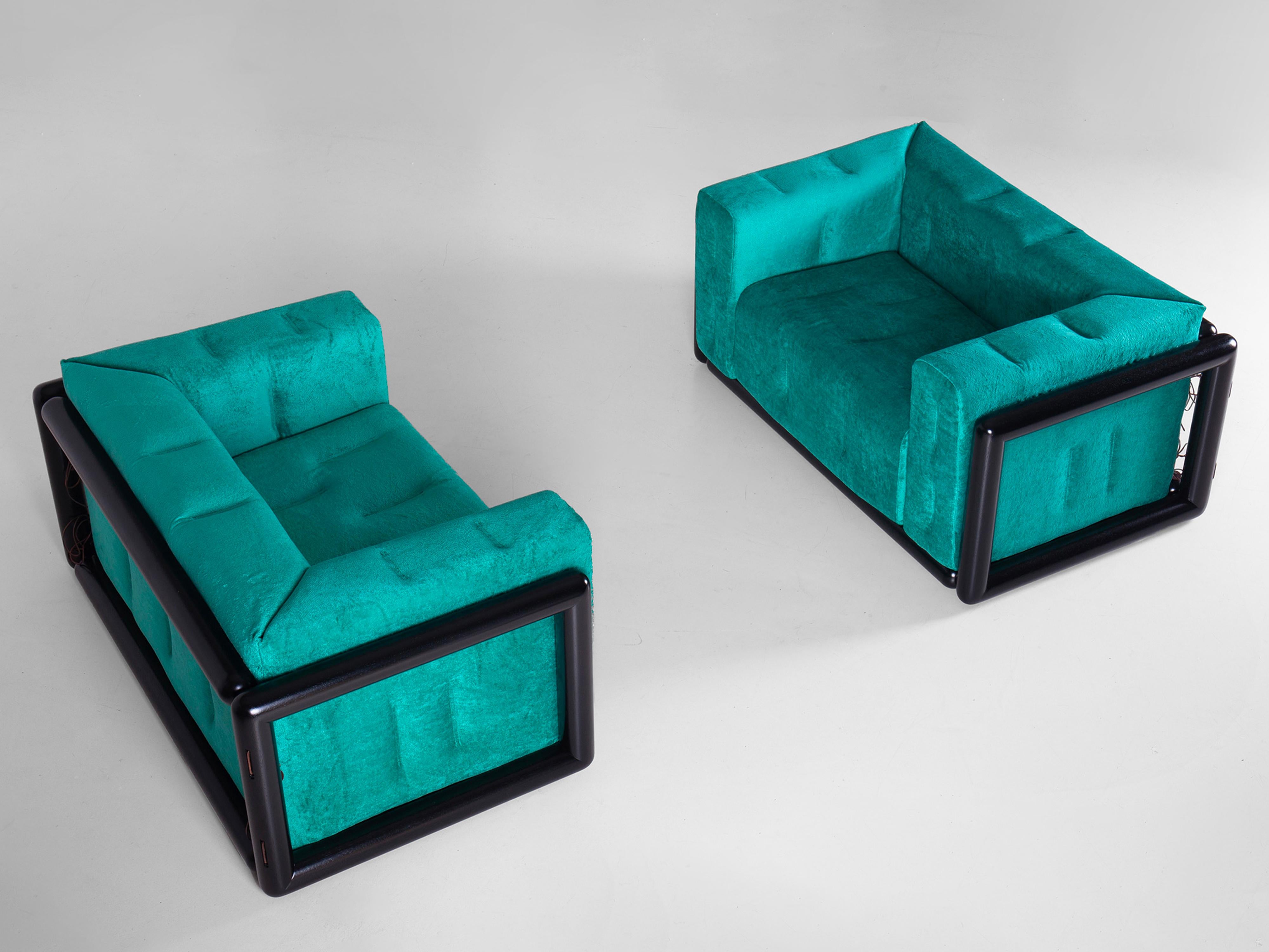 Pair of Cornaro 140 armchairs designed by Carlo Scarpa. Solid hardwood structure (iroko). Polyurethane padding. Upholstery in original chenille velvet. The one-unit side and back cushion is fastened to the frame corners.

At the beginning of the