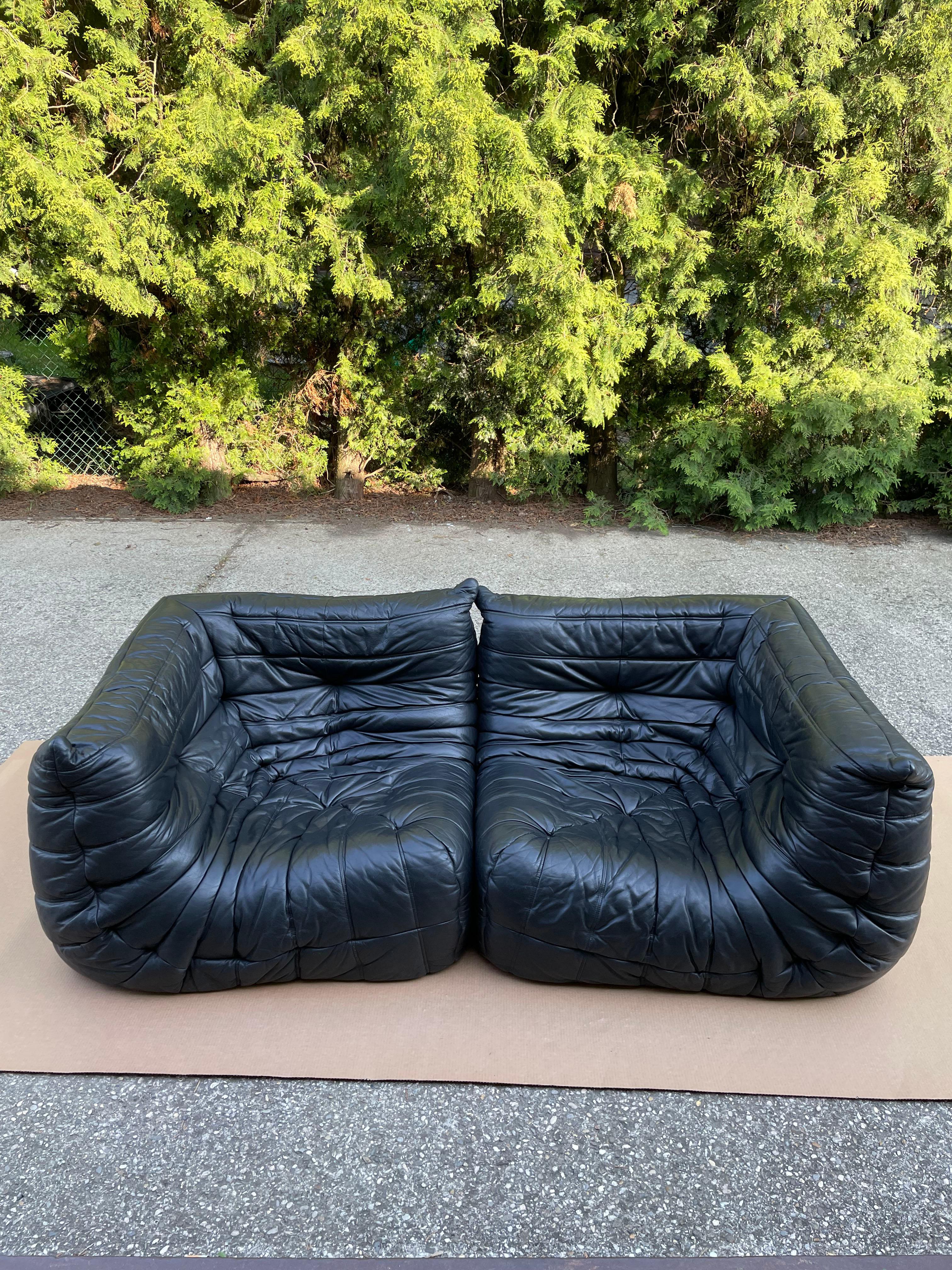 The Togo sofa is a true design classic designed by notable French designer Michel Ducaroy for the high-end furniture maker Ligne Roset in 1973. 

Offered for sale is a pair of Togo corner seats in black leather in great original condition
This is