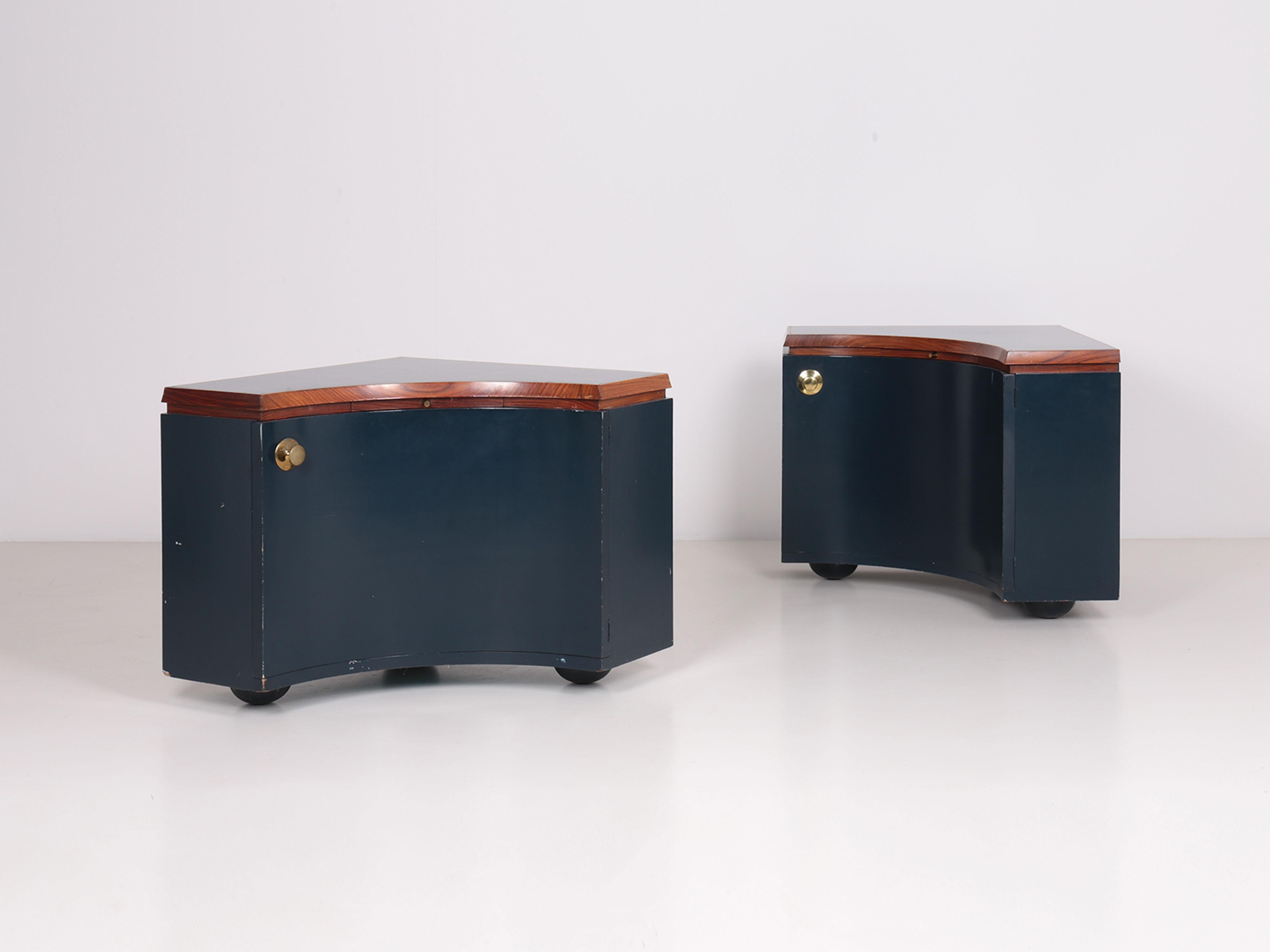 Pair of corner units by Luigi Caccia Dominioni, unique pieces realized for the house of painter Sergio Vacchi in Bologna.

Structure in lacquered wood, rosewood edges and brass finishes. Door with internal drawer and retractable writing desk.