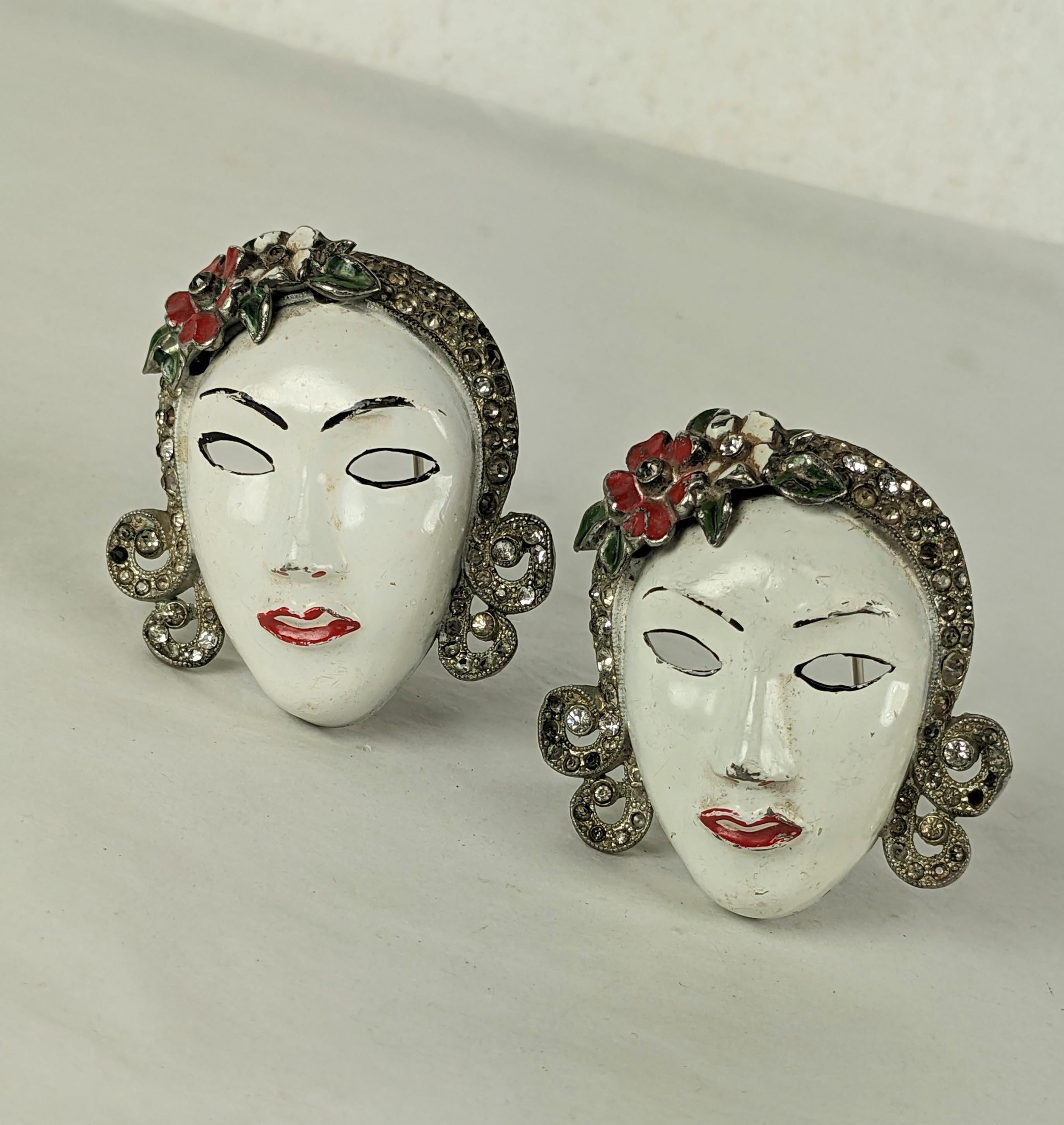 Extremely Rare pair of striking Coro Art Deco Enamel Lady Clips from the 1930's. Large in scale with enameled flower accents and pave stones in hair.
2