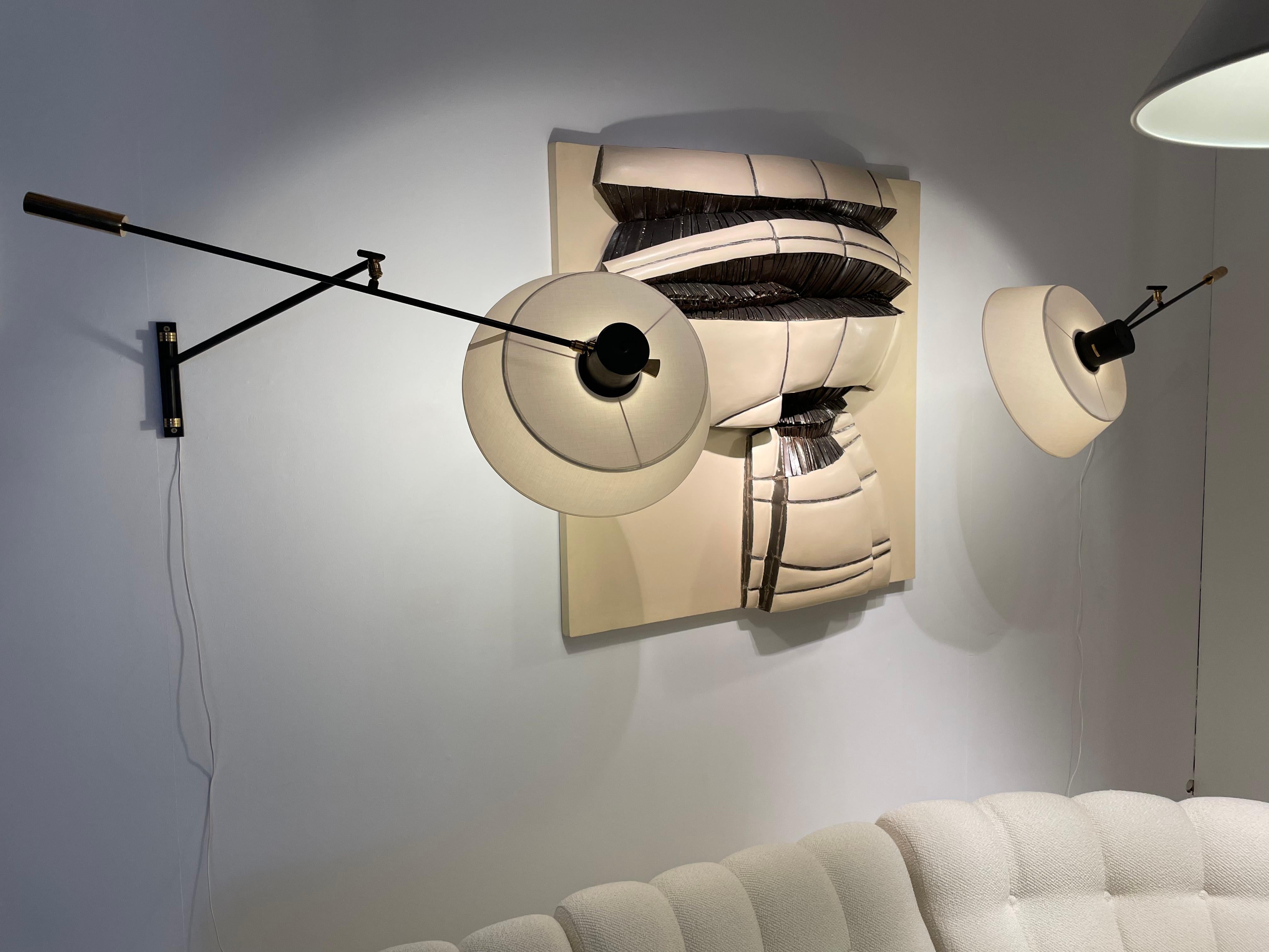 Pair of counterweight sconces by Maison Lunel from 1950
Lunel is a lighting editor traditionally associated with the modern movement for its creations close to those of the first French designers
 The Lunel publishing house has popularized the use