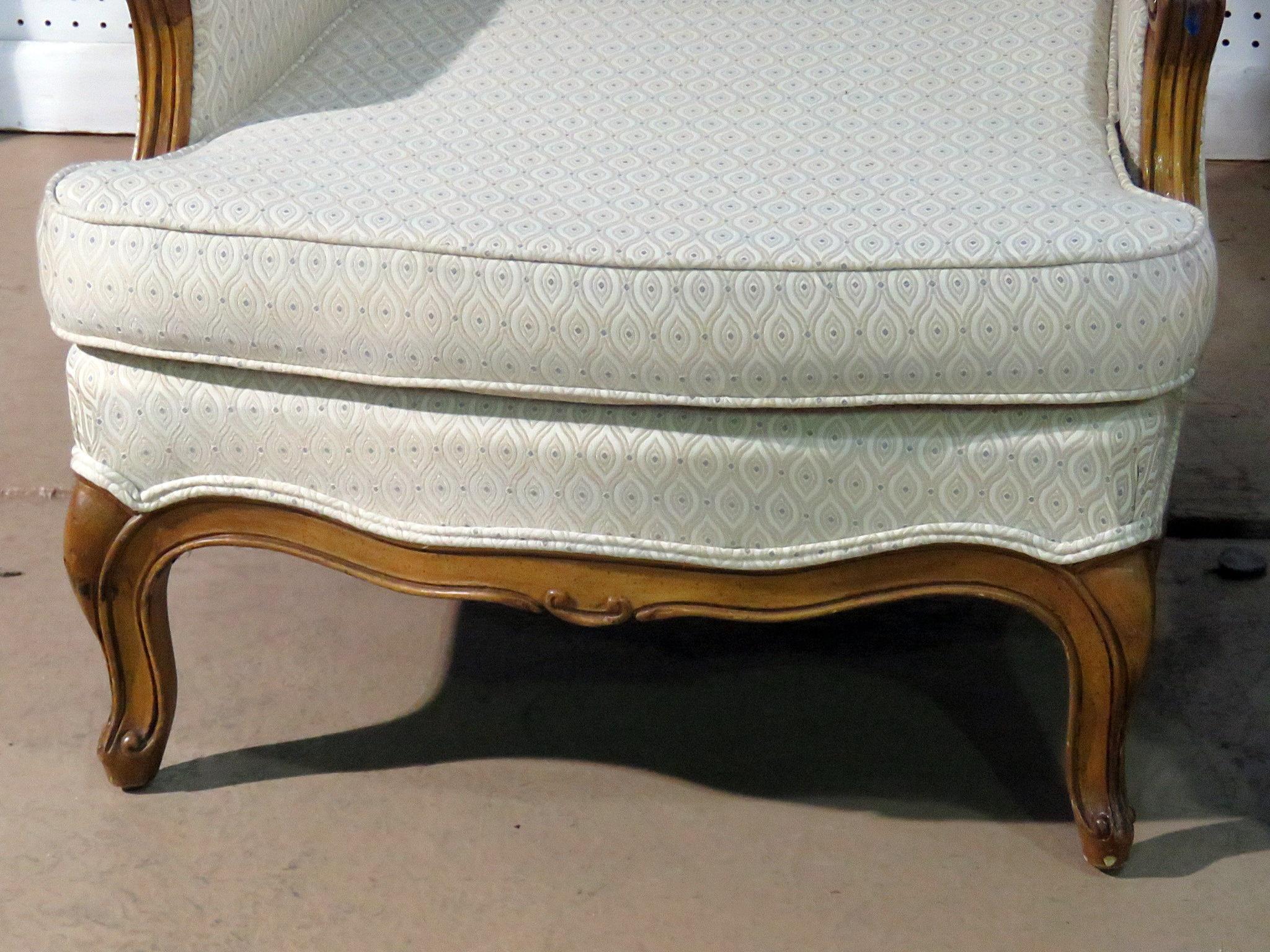 Pair of Country French bergeres with removable cushions.