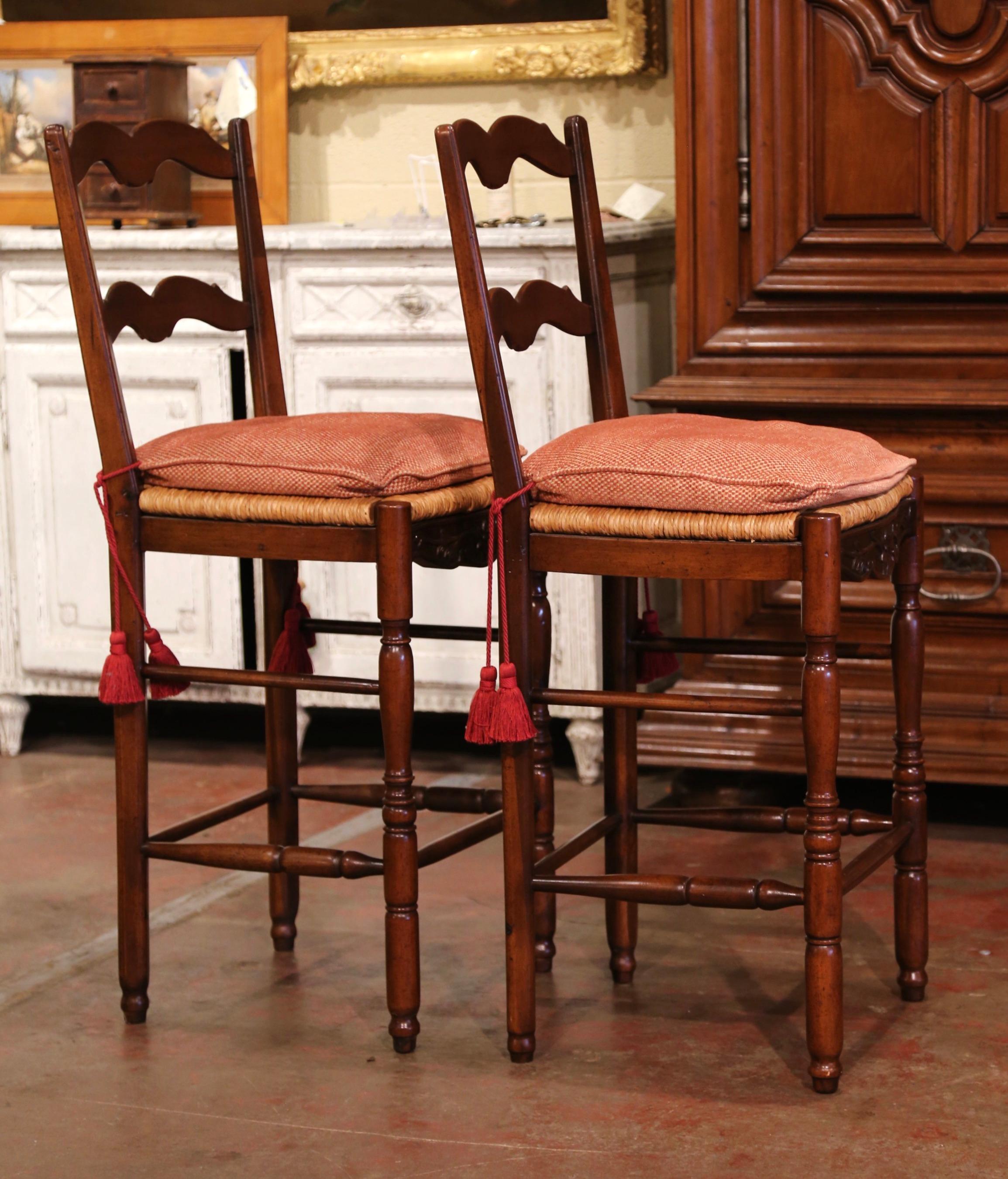 Pair of Country French Carved Ladder Back Bar Stools with Rush Seat In Excellent Condition In Dallas, TX