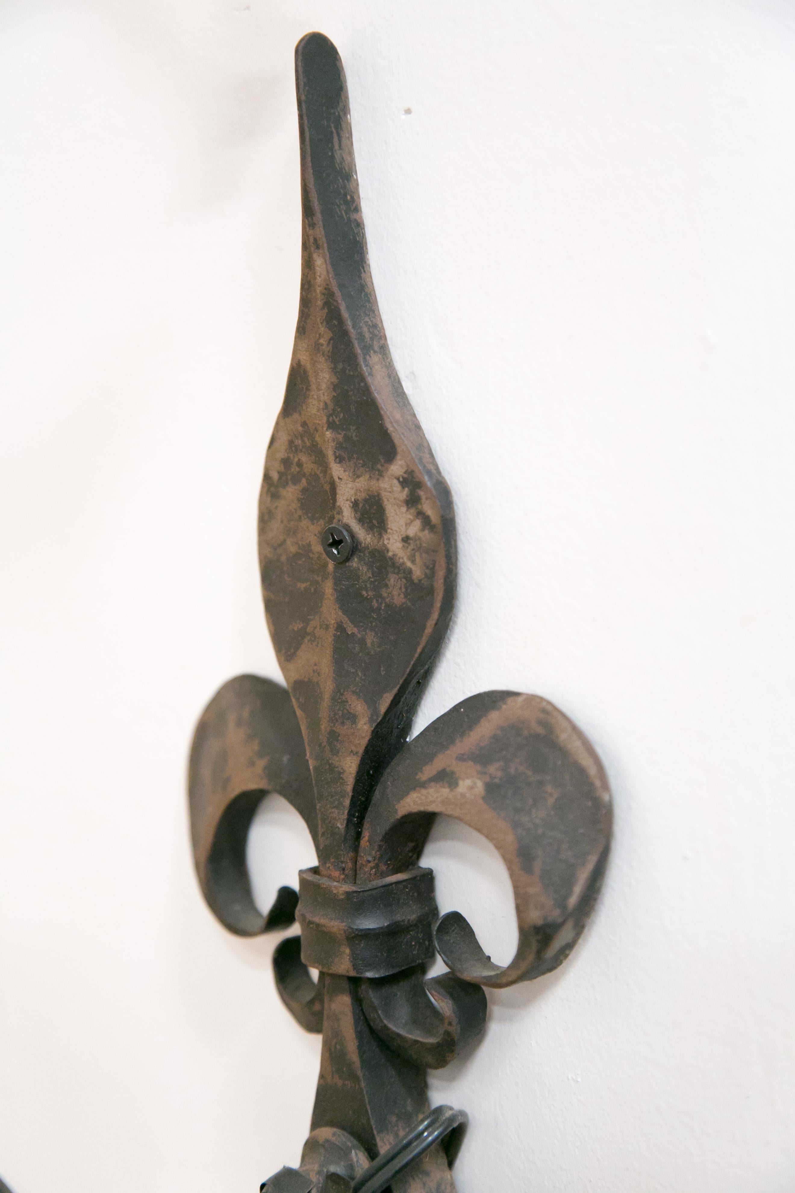 Pair of Country French Hand Forged Iron Fleur-de-Lis Sconces In Good Condition In Birmingham, AL