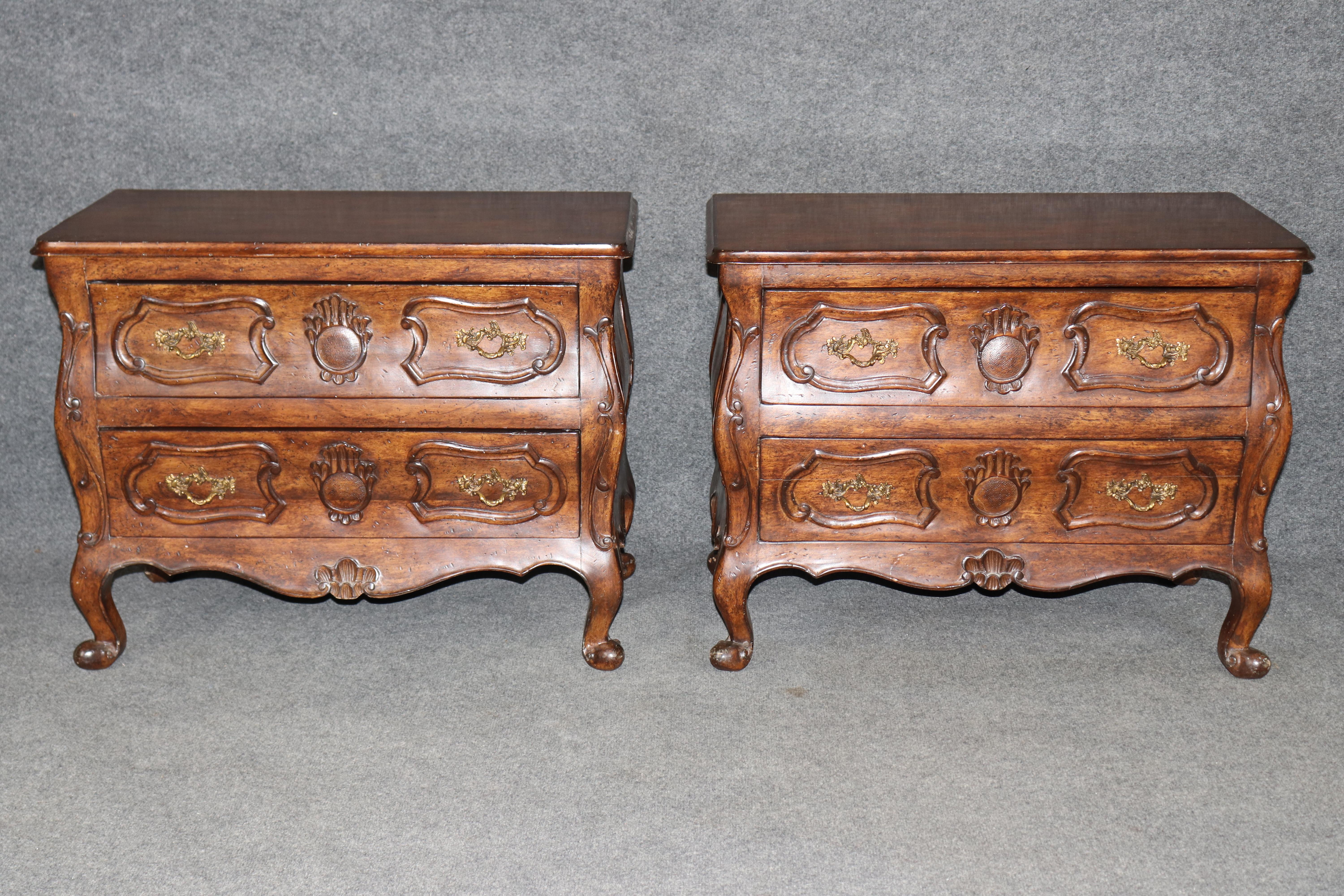 Dimensions - H: 24 1/2 in W: 31 1/2 in D: 17 in

Grace your home with this elegant pair of Country French Louis XV style carved nightstands, beautifully crafted with timeless sophistication and provincial charm. Though unsigned, the quality,