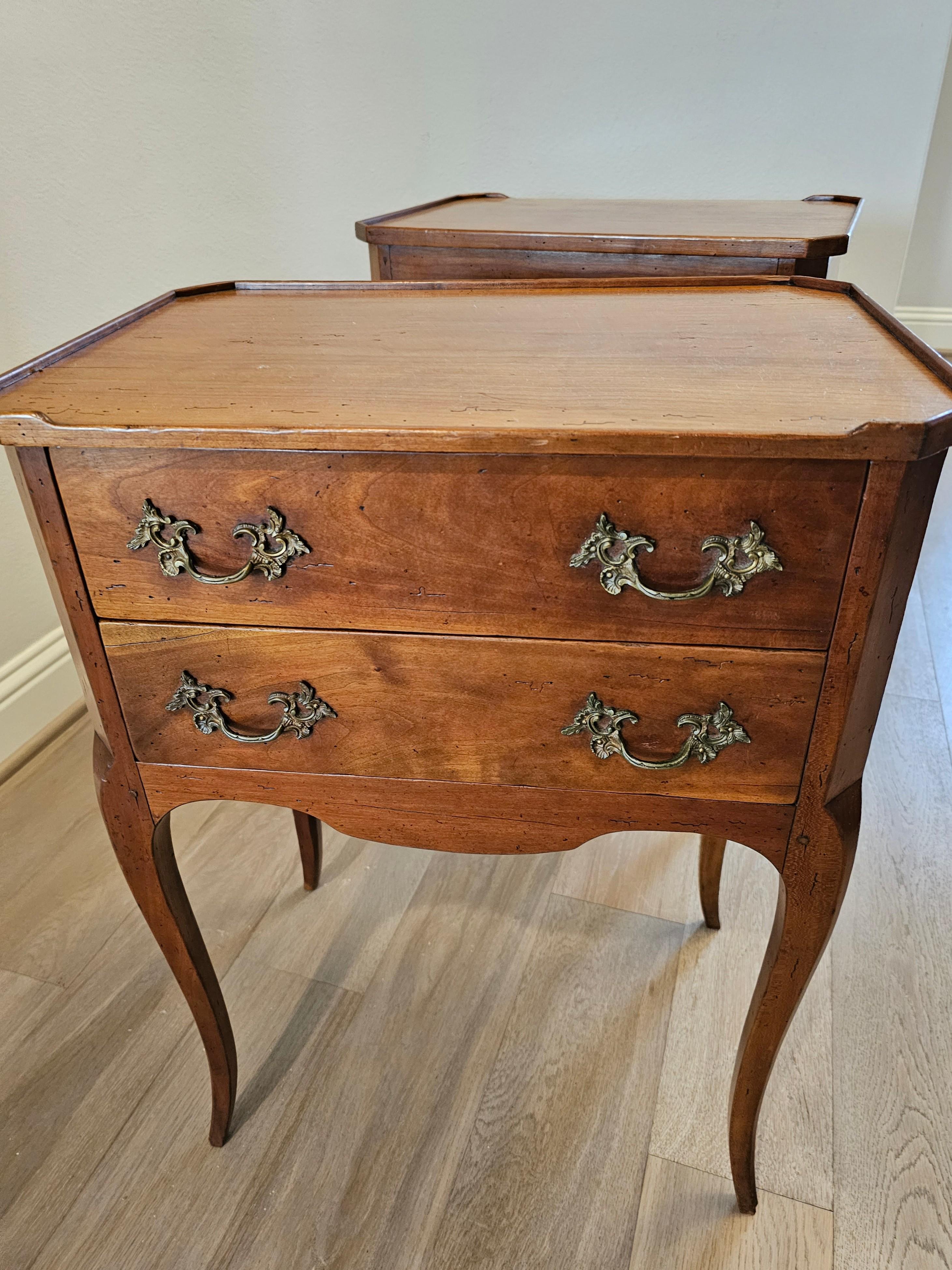 A finely made pair of country French fruitwood nightstands or end tables. circa 1910

Hand-crafted in France in the late 19th / early 20th century, styled in elegant Provincial Louis XV taste, finished on all sides so they can be placed anywhere in