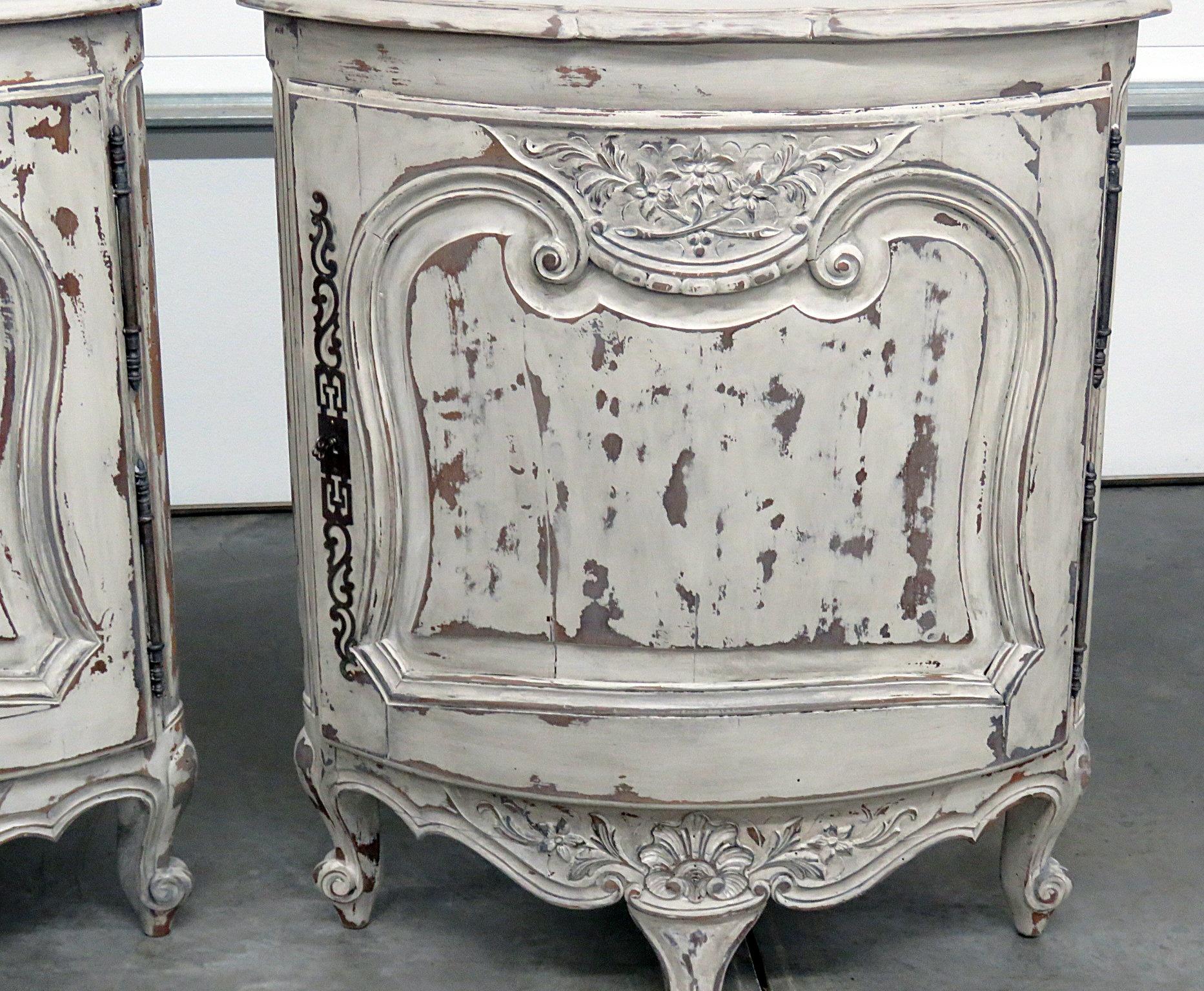 Pair of Country French distressed painted corner cabinets with 1 door containing 1 drawer.