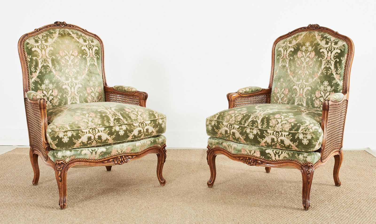 20th Century Pair of Country French Provincial Walnut Cane Bergere Armchairs