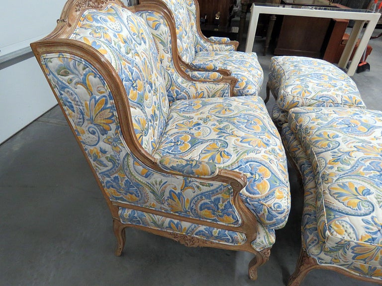 Pair of Country French Style Wingback Chairs and Ottomans For Sale at