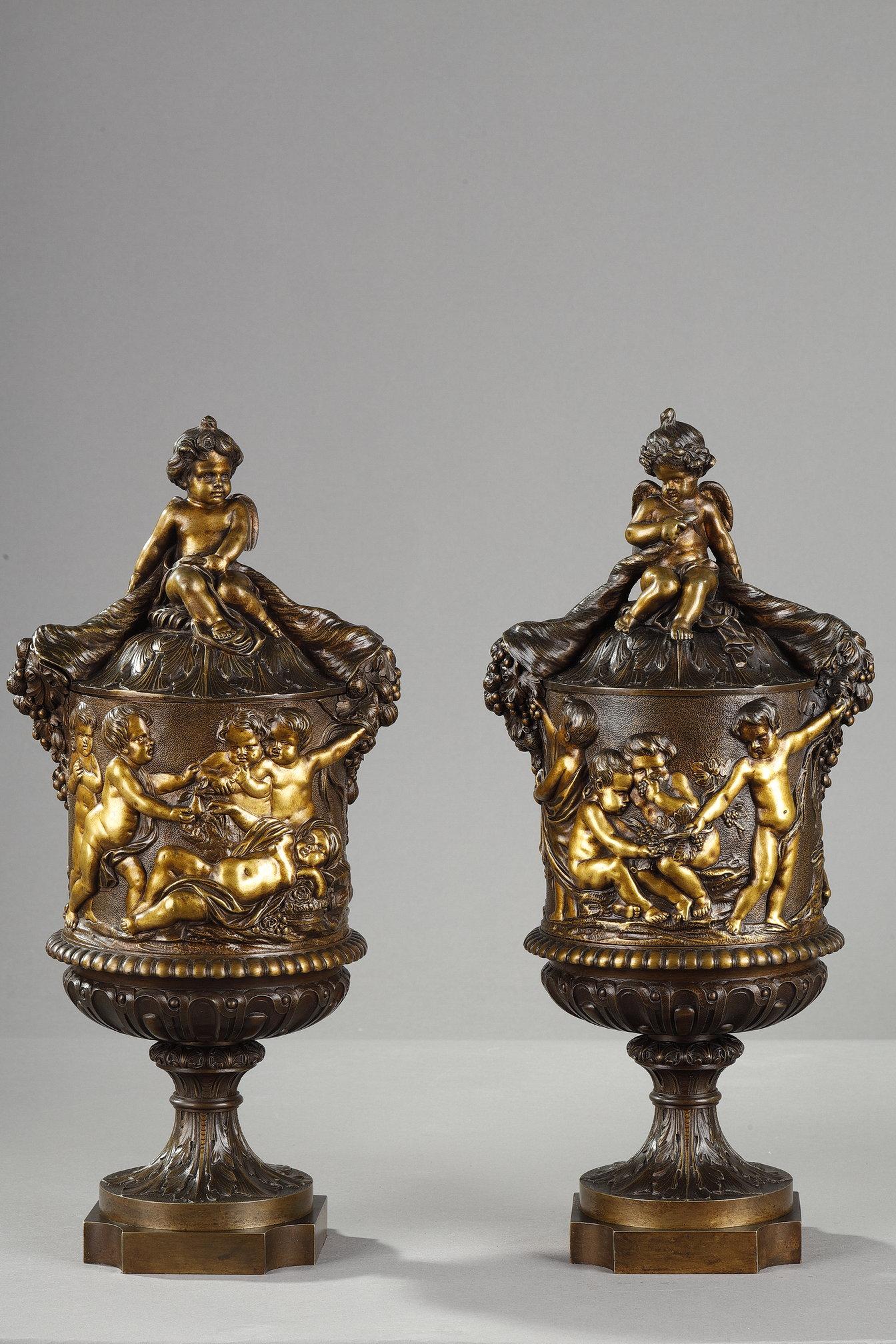 French Pair of covered vases in chased bronze with a rich decoration For Sale
