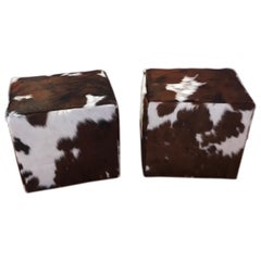 Pair of Cow Hide Benches or Ottomans