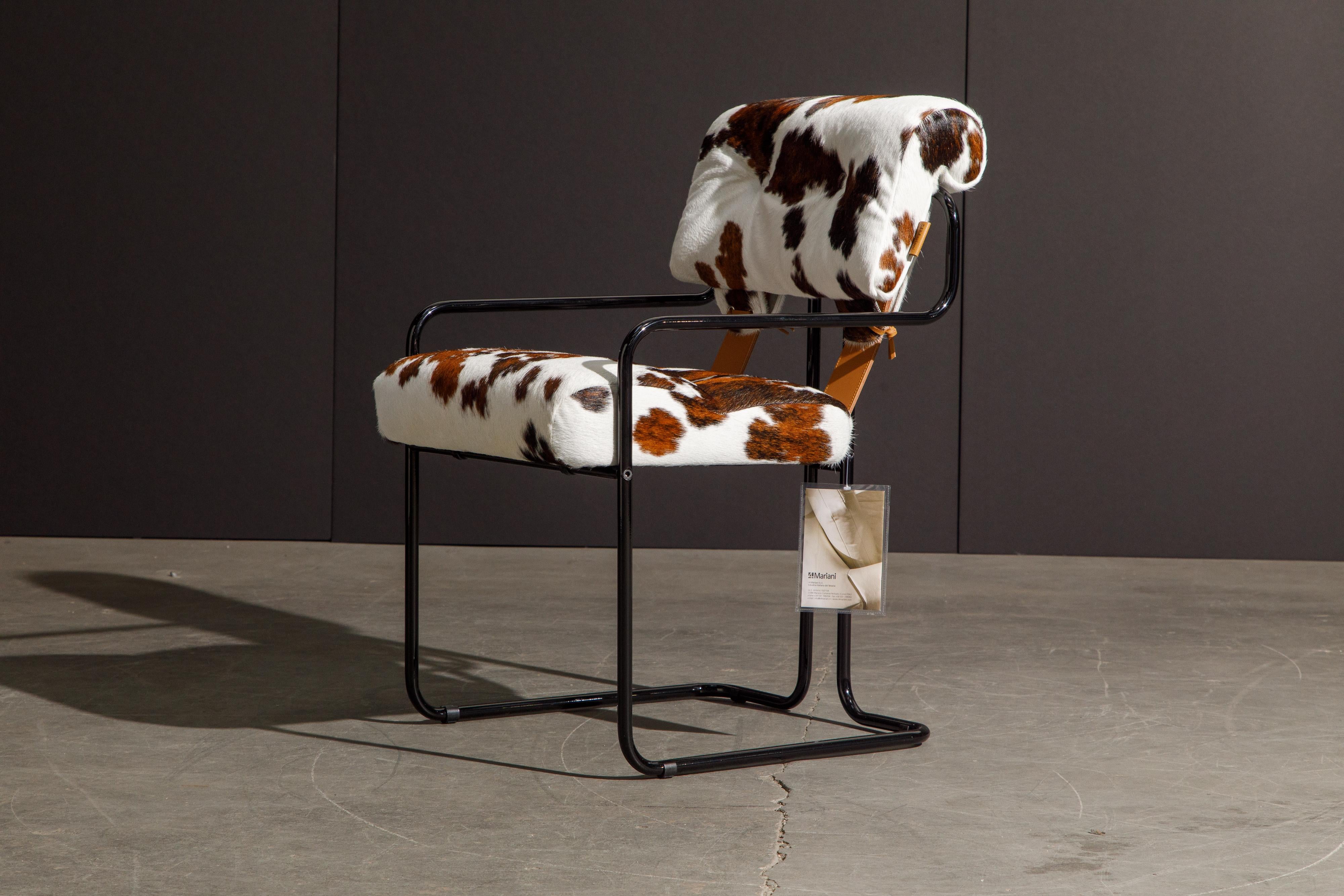 Currently, the most coveted dining chairs by interior designers are 'Tucroma' chairs by Guido Faleschini for i4 Mariani, and we have this incredible pair (2) of Tucroma armchairs in beautiful spotted brown and white cowhide leather with black