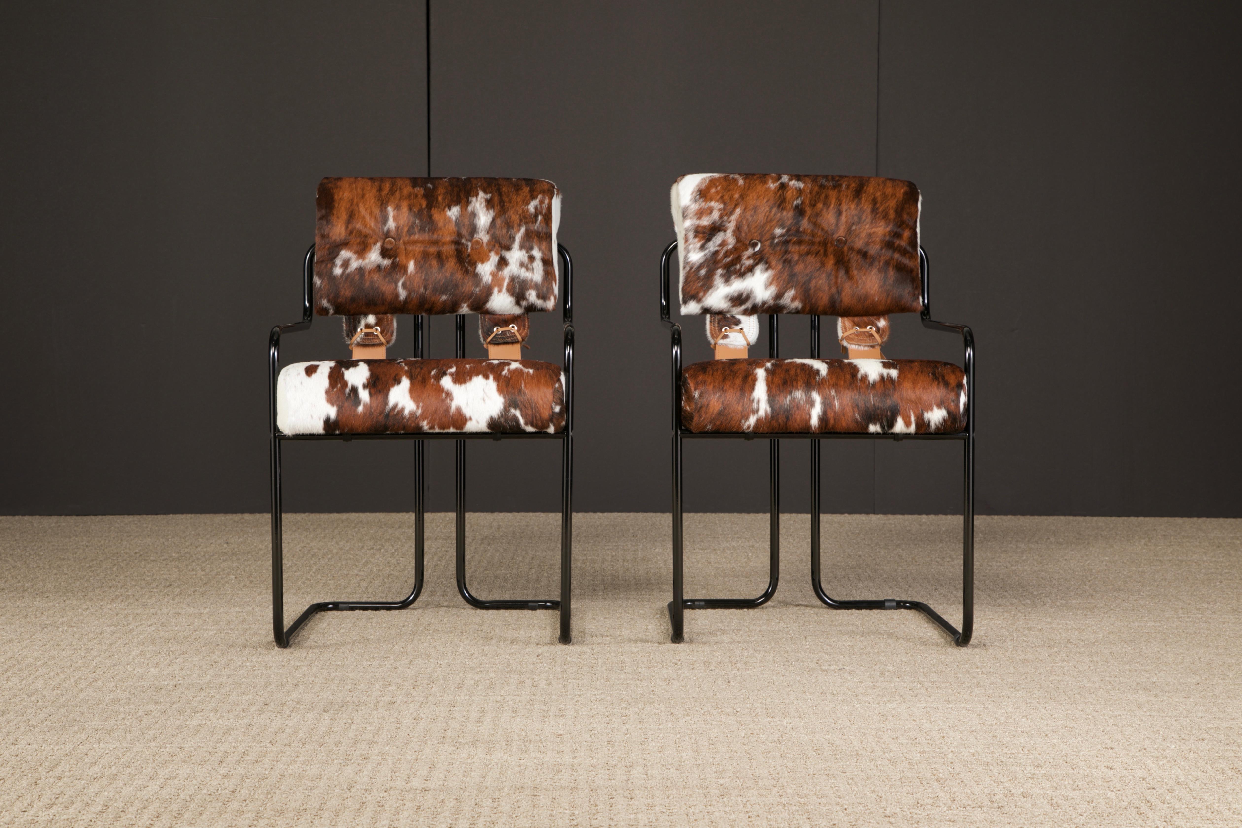 Currently, the most coveted dining chairs by interior designers are 'Tucroma' chairs by Guido Faleschini for i4 Mariani, and we have this incredible pair (2) of Tucroma armchairs in beautiful spotted brown and white cowhide leather with black