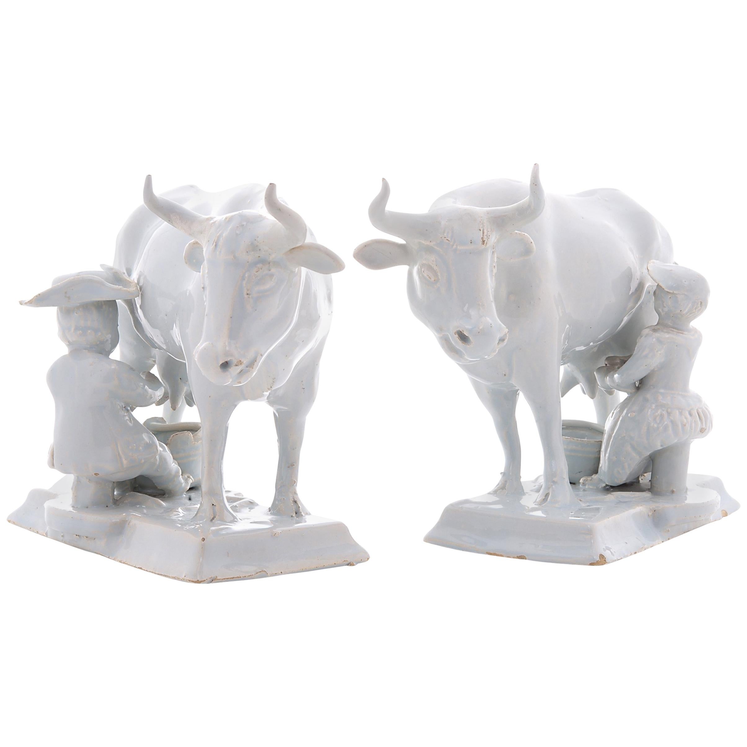Pair of Cows with Milkers in White Dutch Delftware For Sale