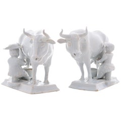 Pair of Cows with Milkers in White Dutch Delftware