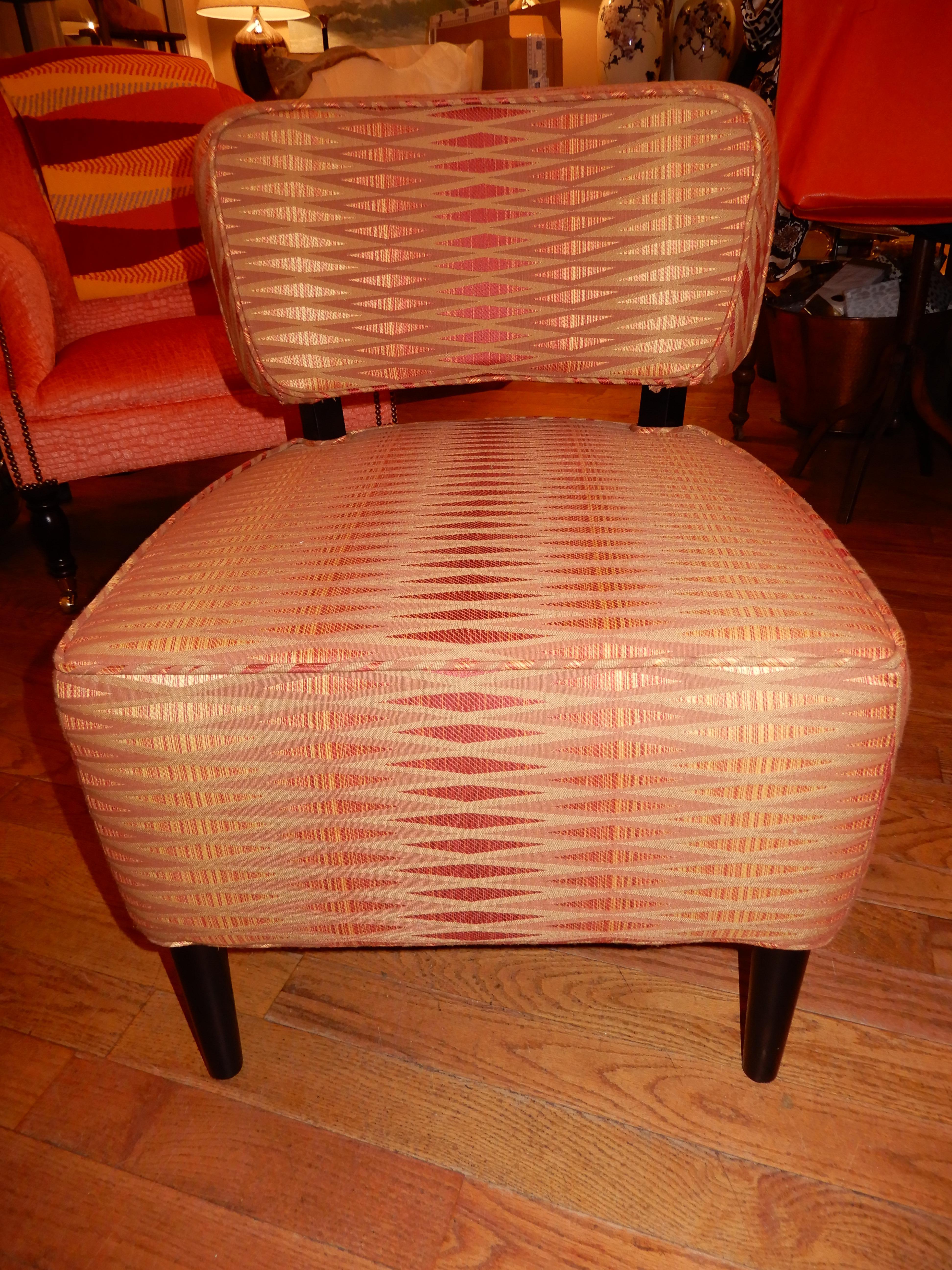 Fabulous pair of Mid-Century Modern side chairs or slipper chairs. Contemporary fabric in shades of rusts, reds, and gold's
Excellent condition, luxuriously comfortable. Ebony wood legs.