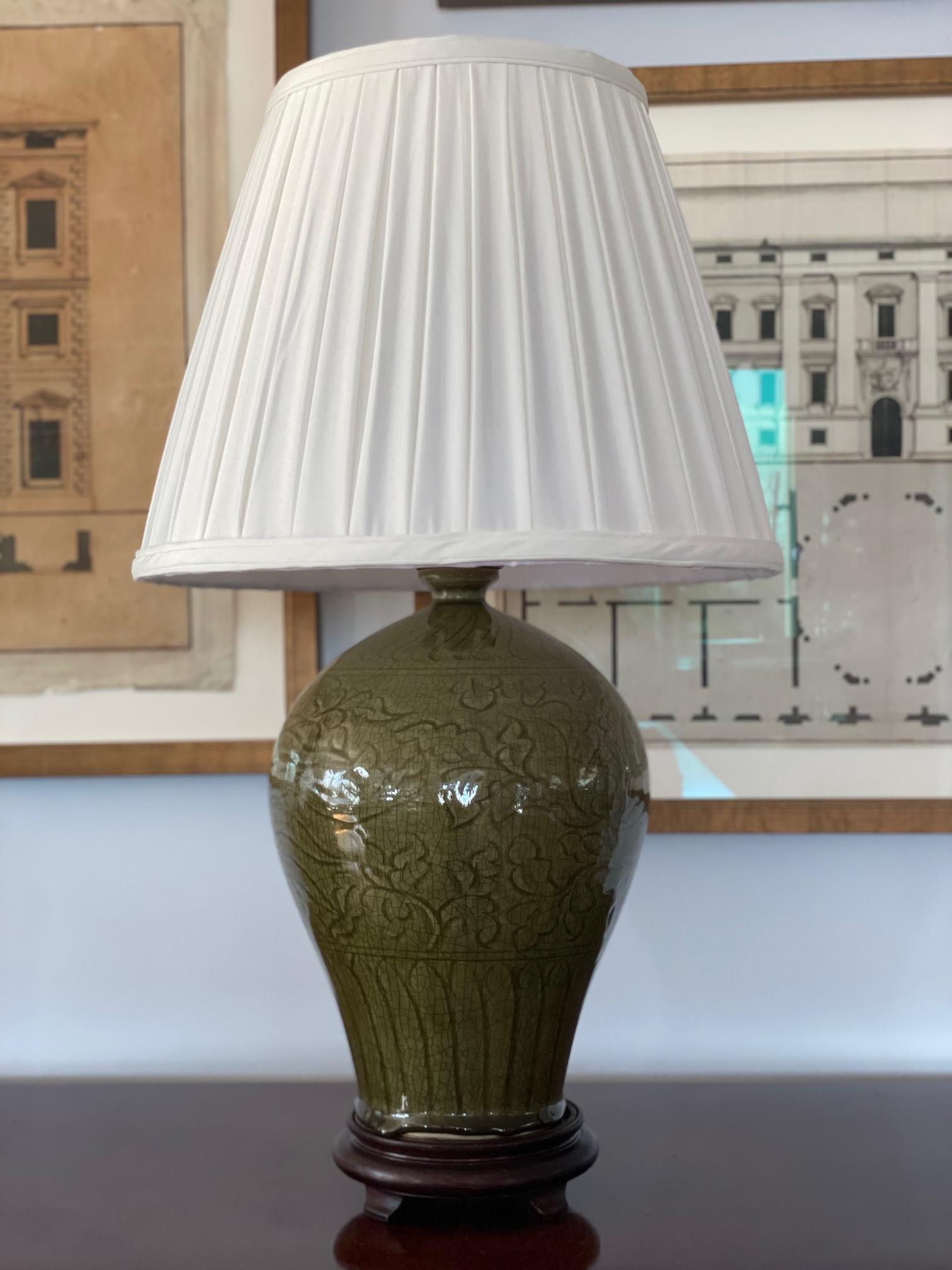 Pair of crackle Celadon green table lamps with Foliate Motif. 20th Century.