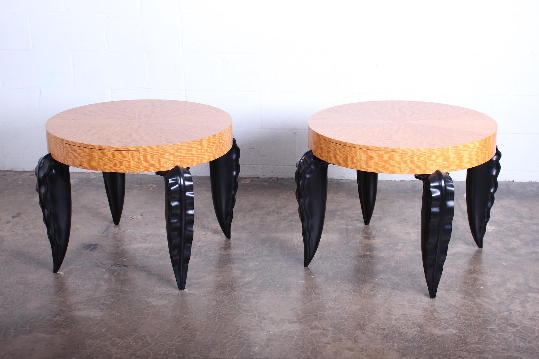 A pair of studio craft tables by Peter Dudley signed and dated 1999. Curly maple tops with carved ebonized legs and a single drawer.